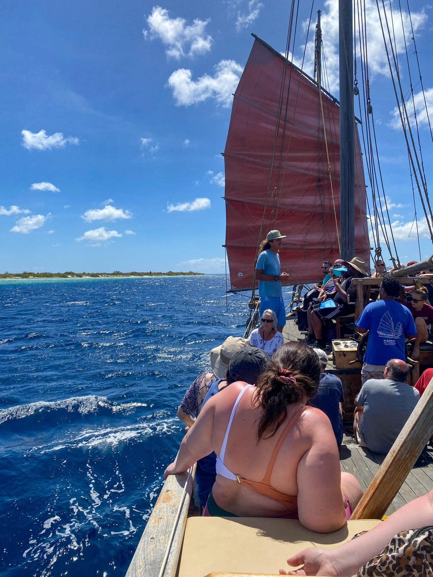 Passengers aboard a sailing catamaran off the coast of Bonaire