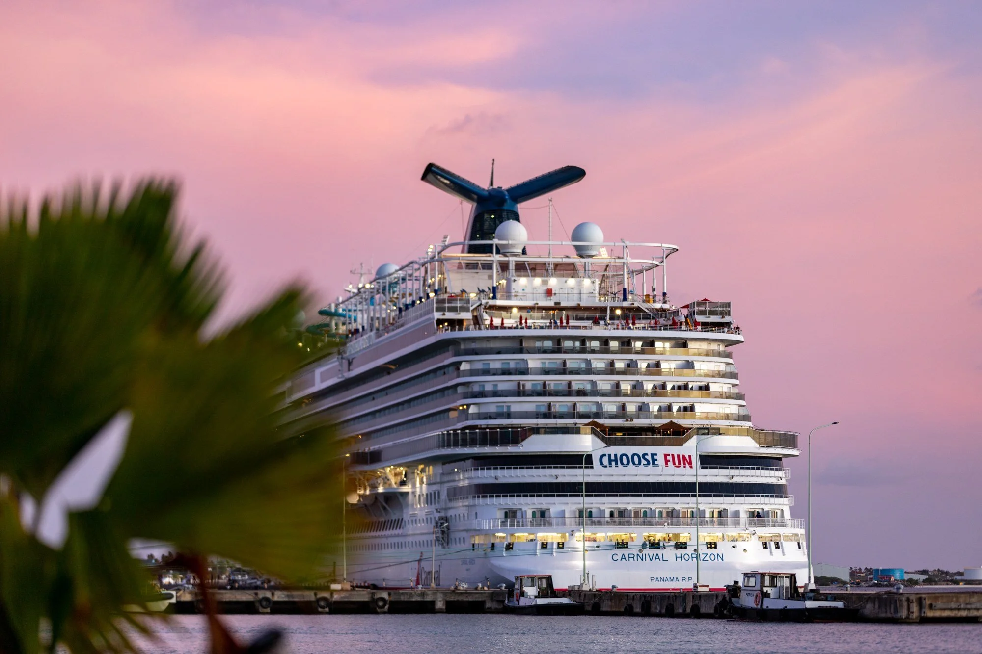 Carnival Horizon docked in Bonaire during a pink sunset