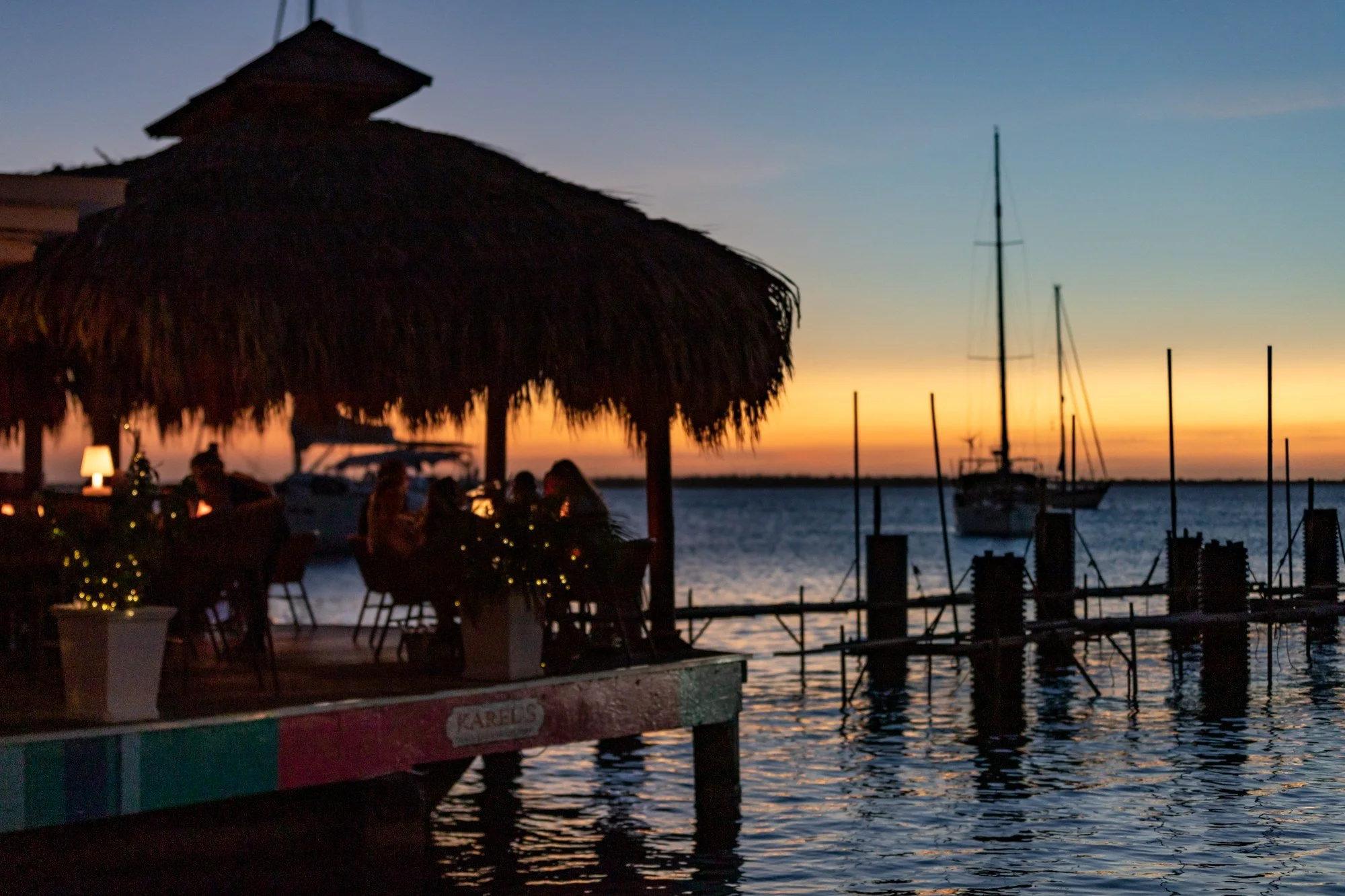 Waterfront restaurant silhouetted at sunset in Kralendijk, Bonaire