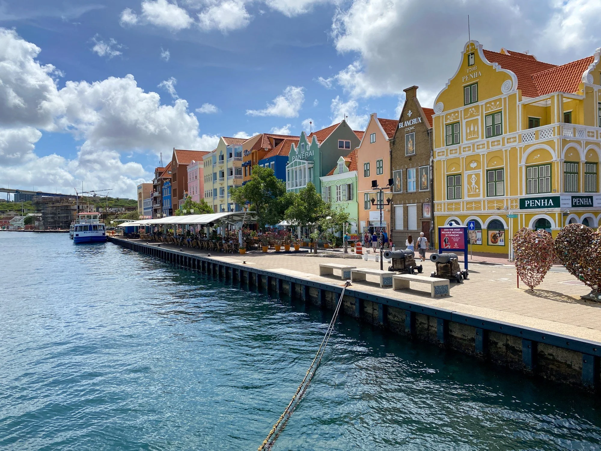 Colorful waterfront buildings lining the harbor in Willemstad
