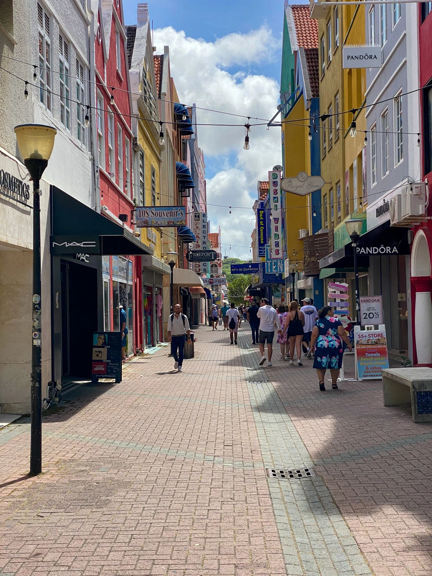 Pedestrian street lined with colorful buildings in Willemstad