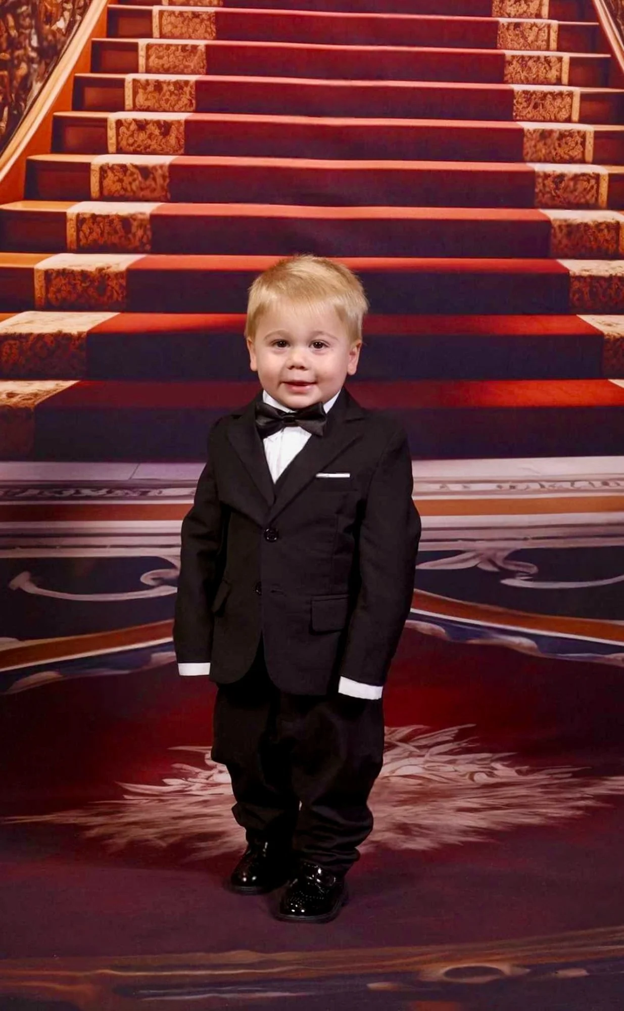  Daniel dressed formally on the ship’s staircase 