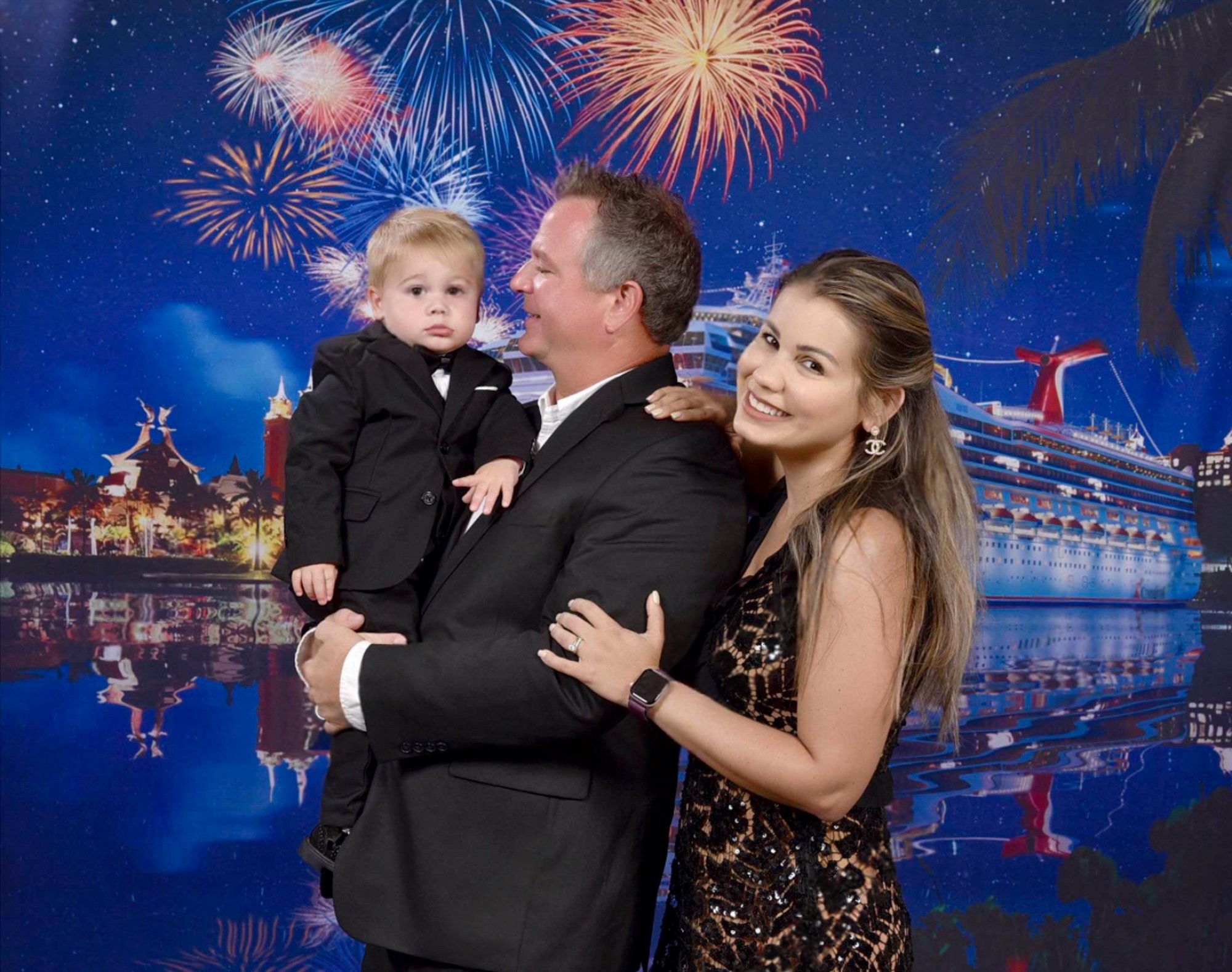 Formal family portrait with the cruise-themed backdrop 
