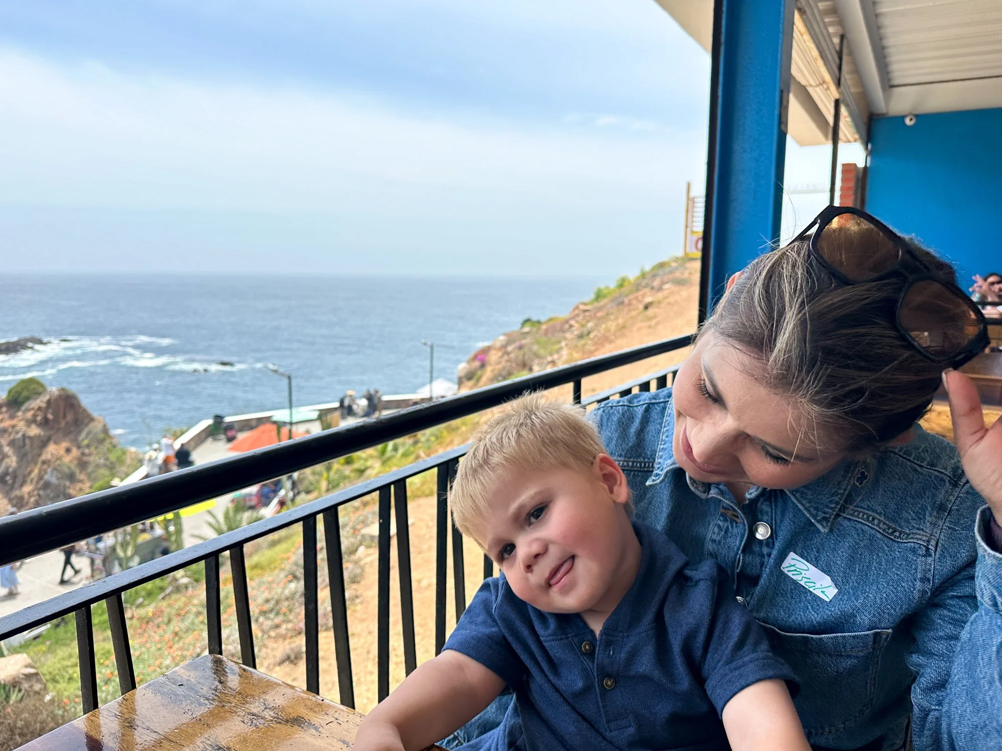 Amanda and Daniel together at a coastal overlook near La Bufadora in Ensenada.