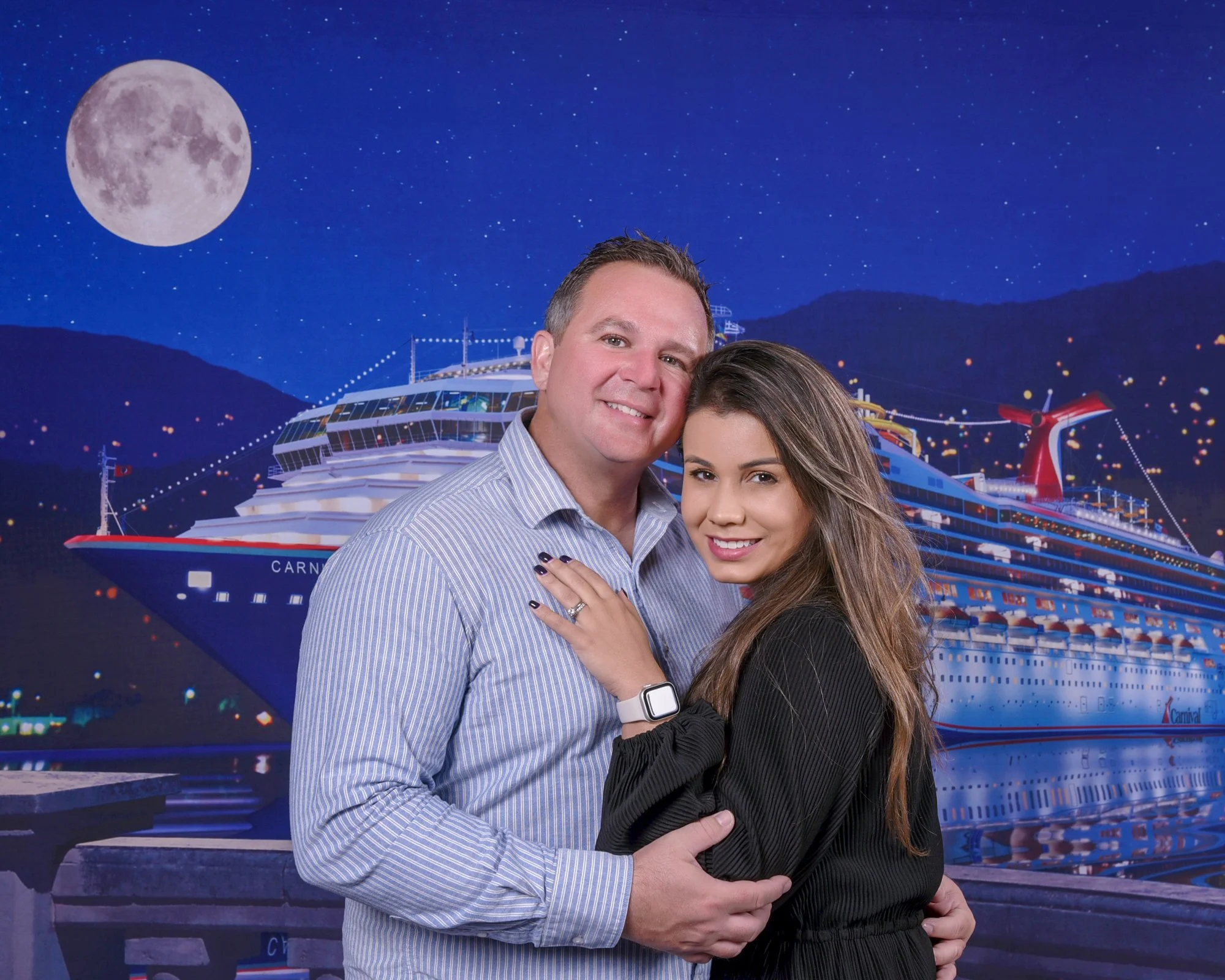 Jason and Amanda posing for a portrait aboard Carnival Radiance