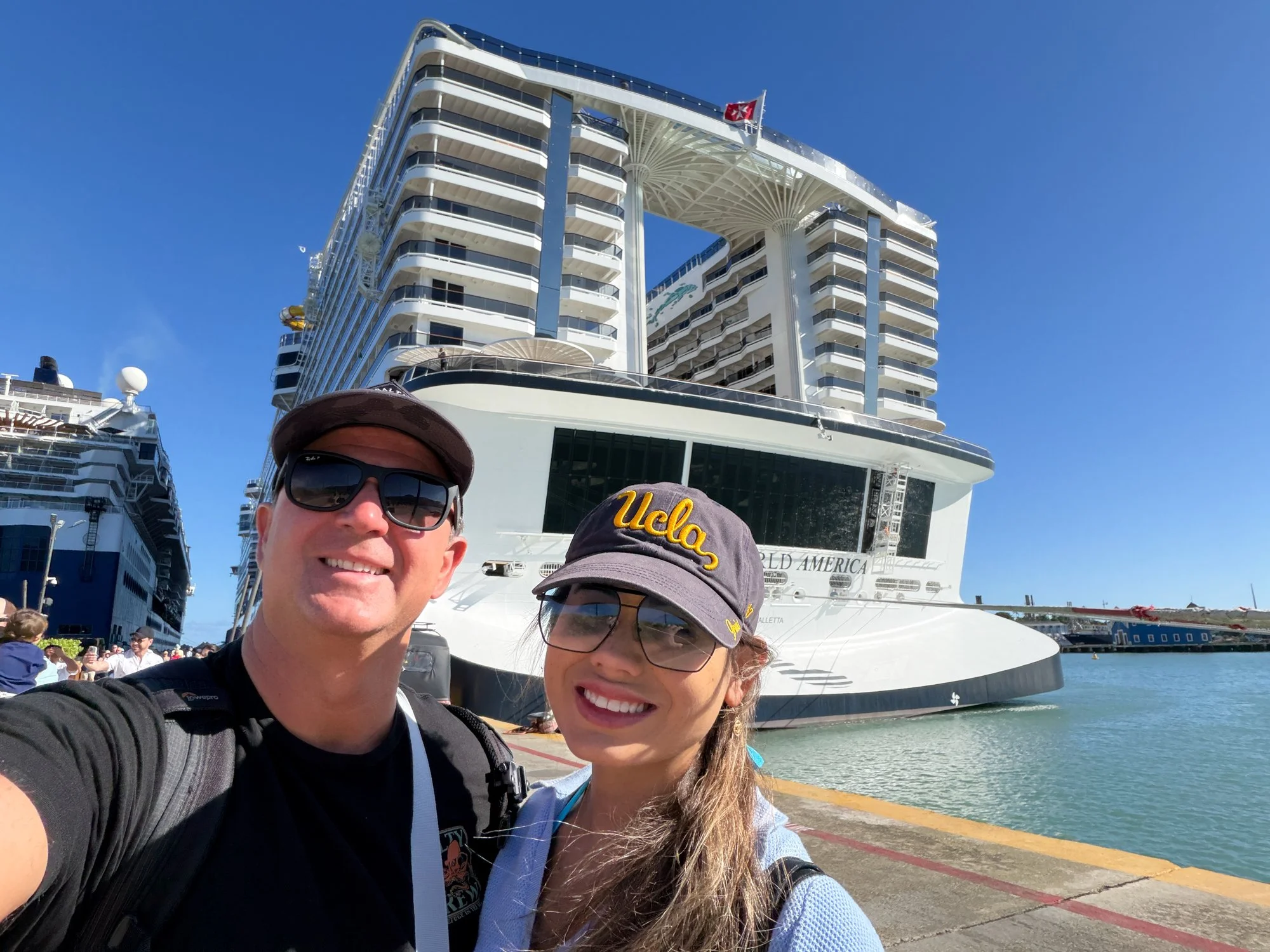 Travelers posing in front of MSC World America at the Puerto Plata cruise port.