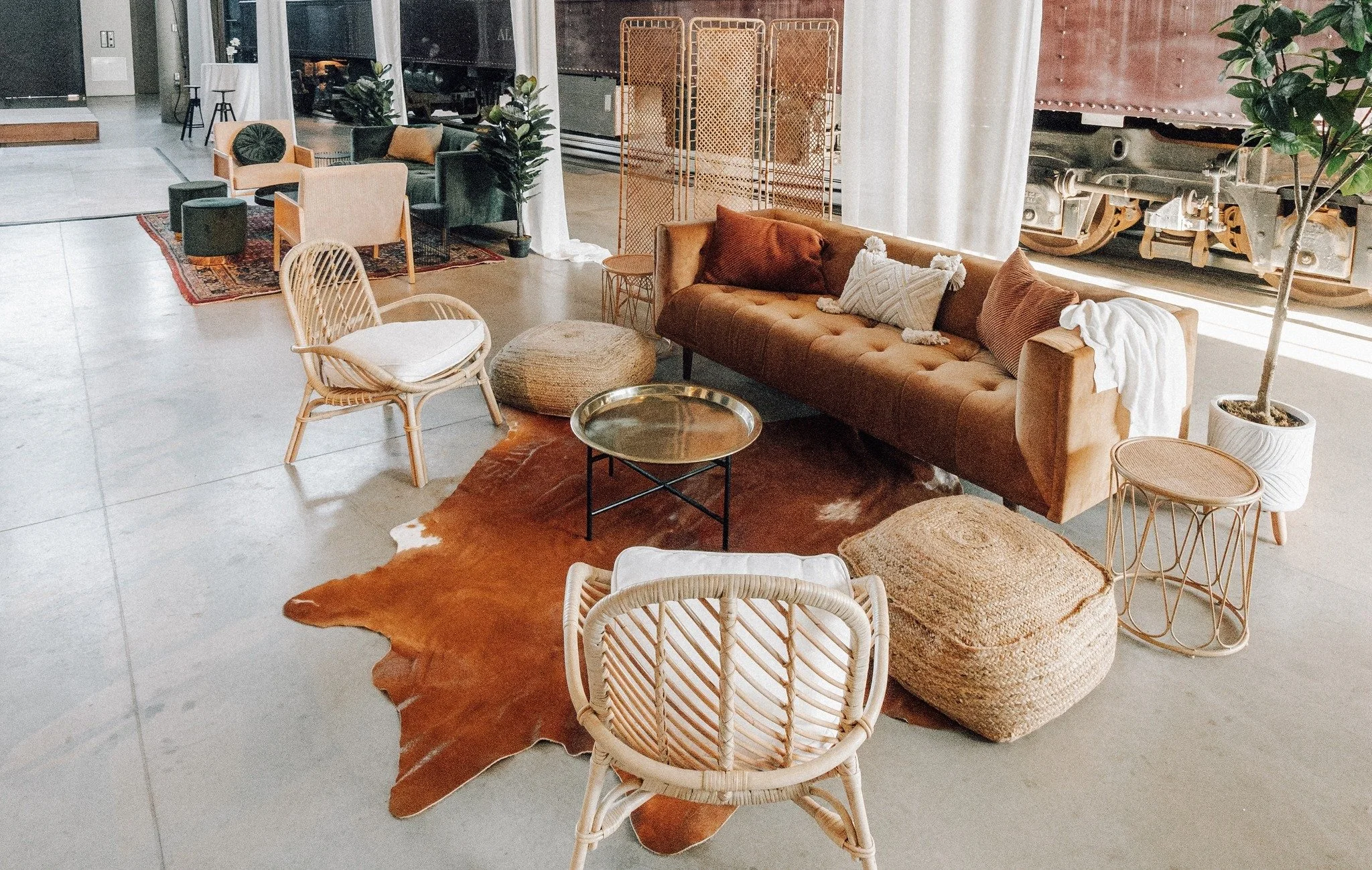 The designated spot for the "we need a group photo" moment. 📸 Elevate your event design with Blacksheep.

Items featured in photo: Copper velvet sofa, rattan armchair + cushion, jute ottoman, rattan side table, gold table, rattan divider, 