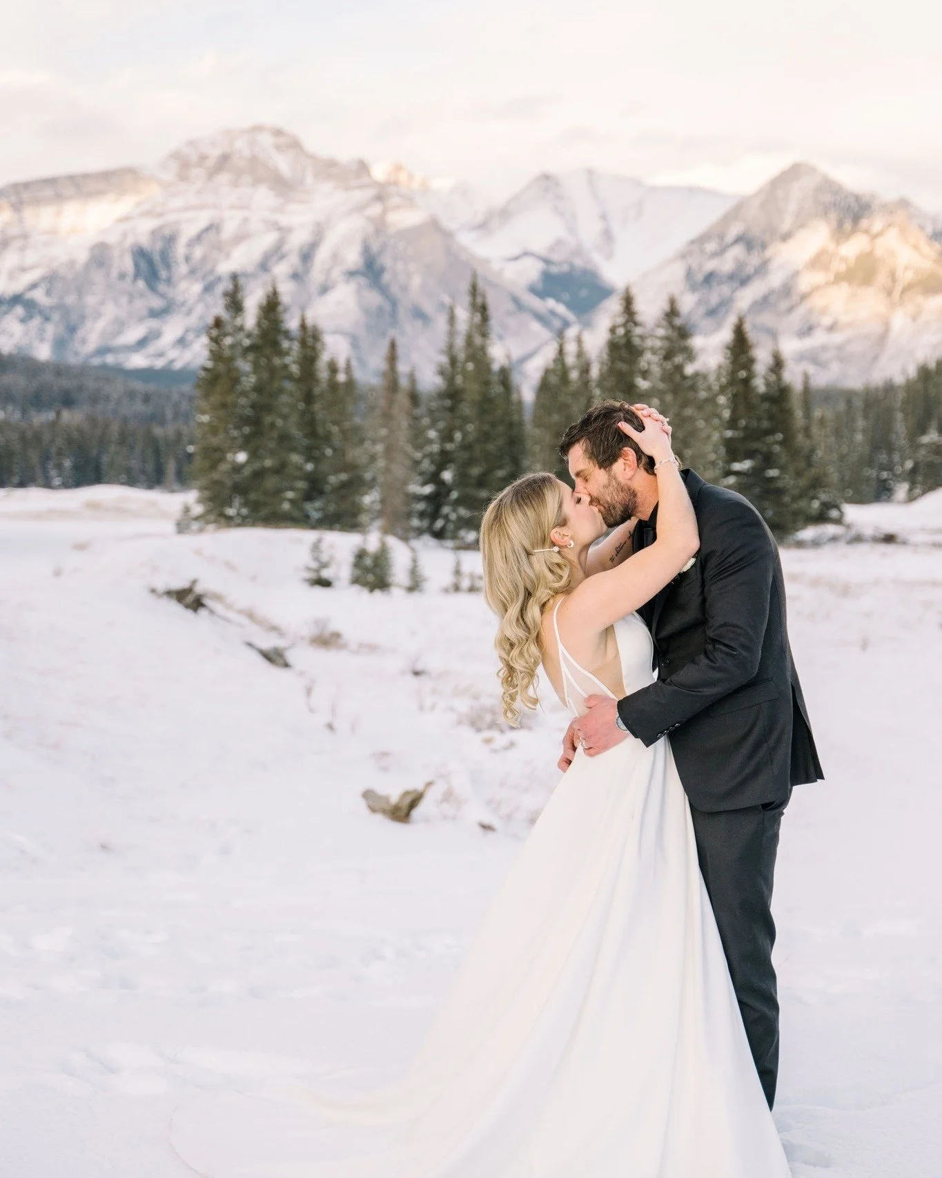 Adam and Courtney in the quiet moments around their wedding at Buffalo Mountain Lodge. The snow, the light, and the setting could not have been more picturesque.

#weddingphotography #newlyweds #weddingplanner #weddingplanning #banffweddings