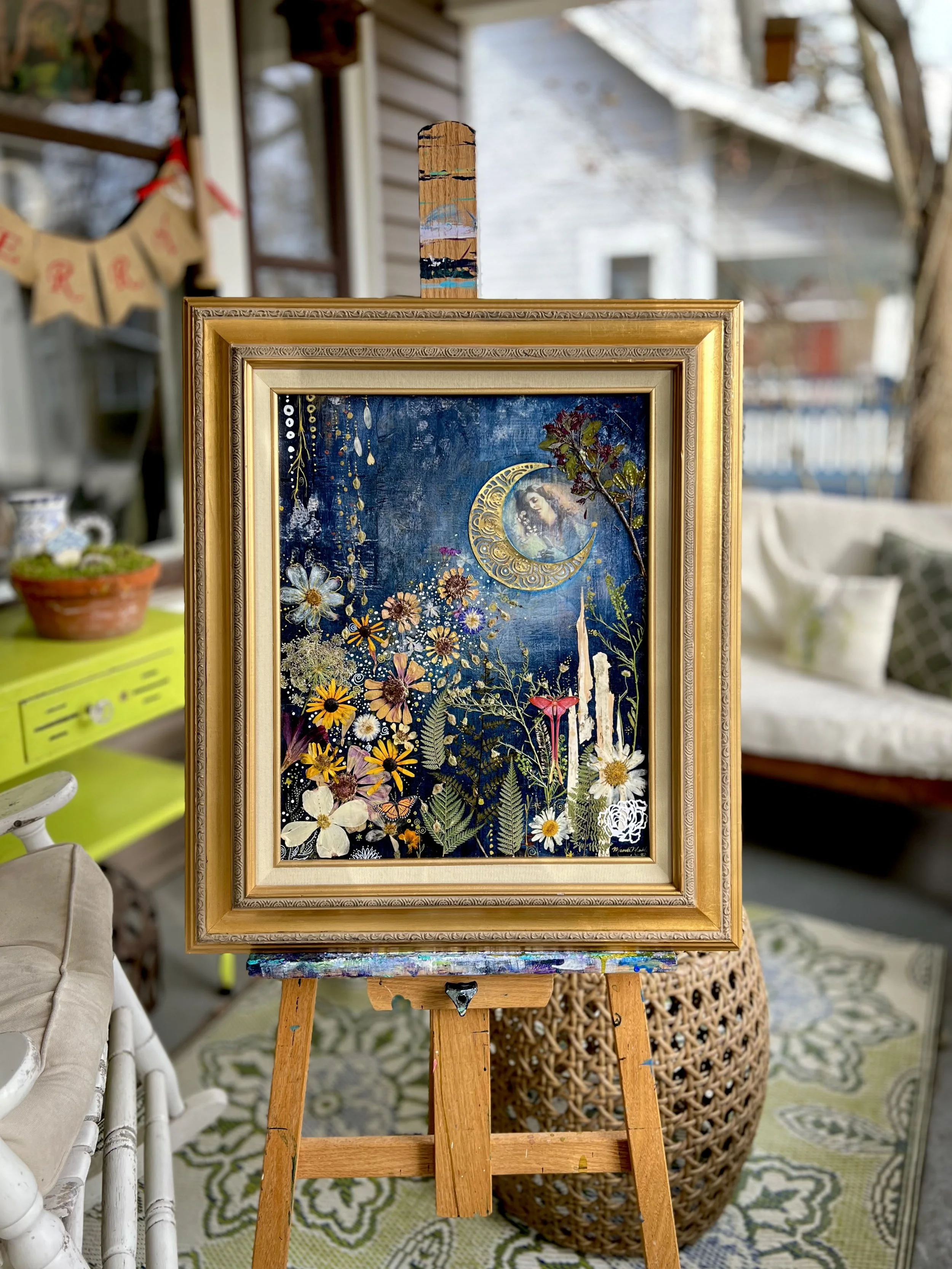 Woman on moon sending beam of flowers into a garden below.