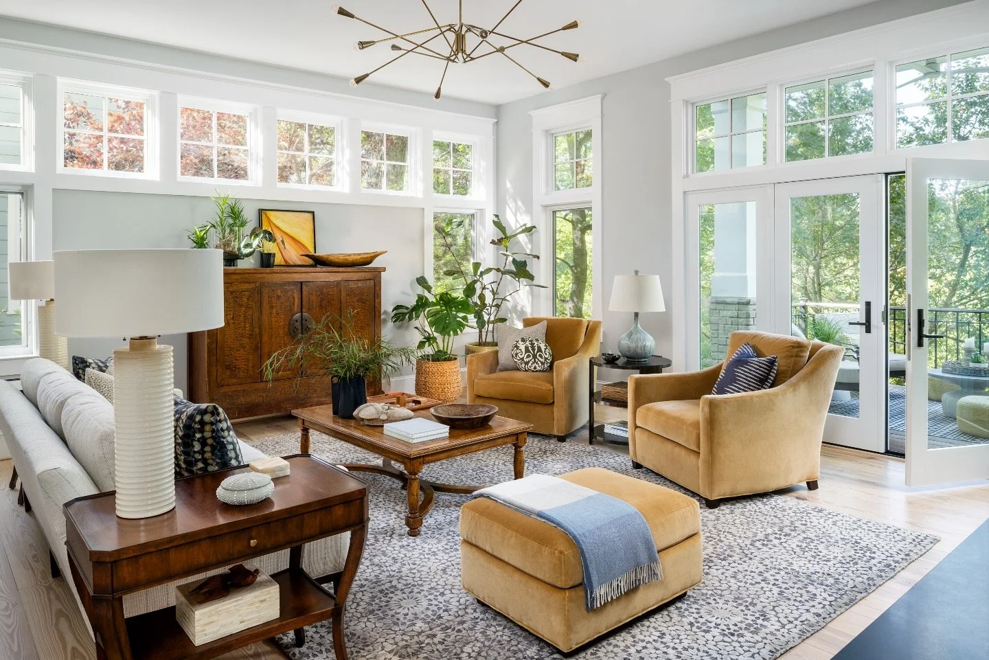 Happy Earth Day from Waterlily Interiors! Today we&rsquo;re celebrating the beauty of nature&mdash;both outside and in. This sunlit living room brings the outdoors in with natural wood tones, sustainable design choices, and plenty of greenery. 
Earth