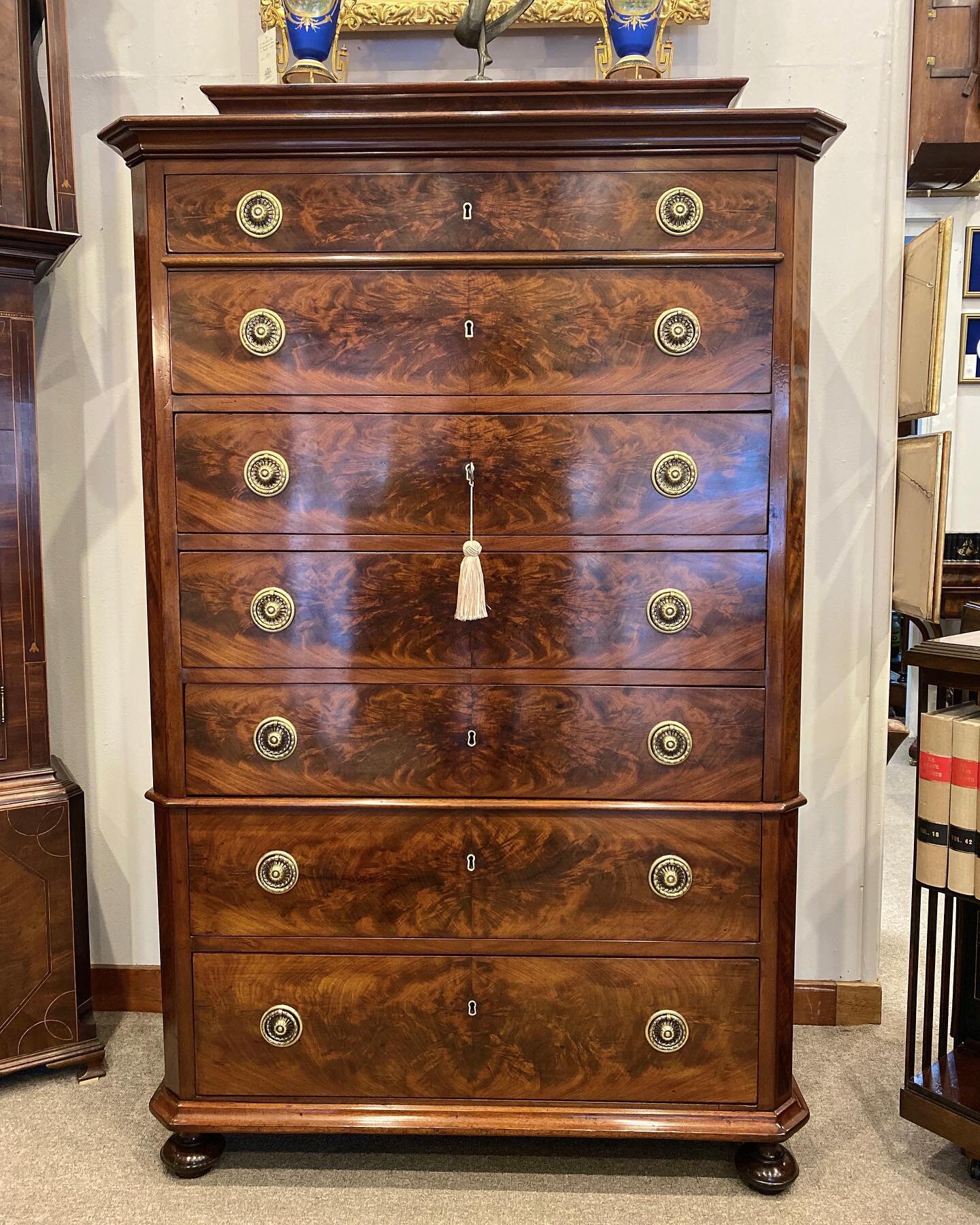 Just Arrived is this superb quality 19th century flame mahogany two part seven drawer chest, shaped moulded lifting top, brass drop ring handles and beveled cross banded edge.