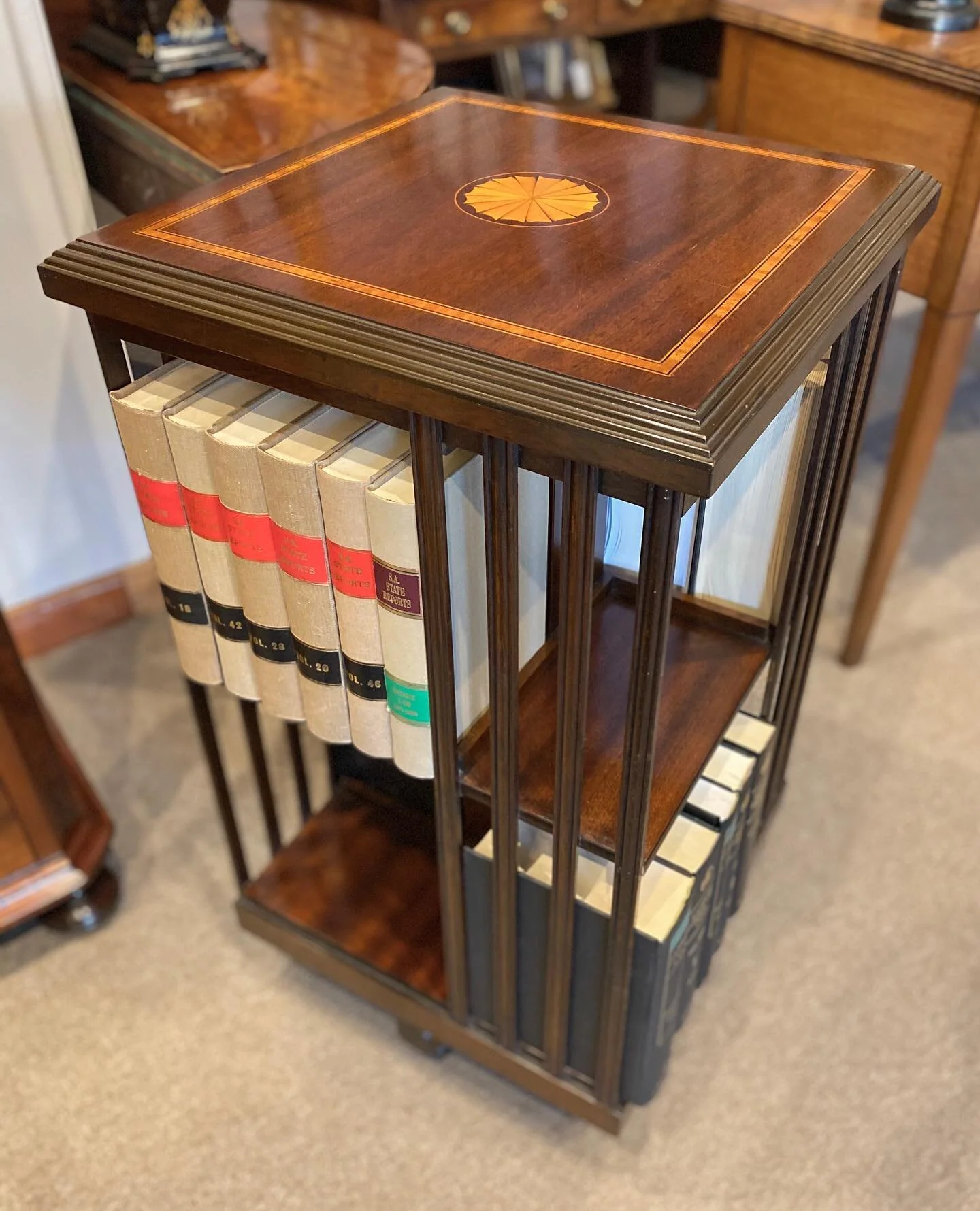 Just arrived is this early 20th century two tiered mahogany revolving bookcase, top features cross banding and inlay.