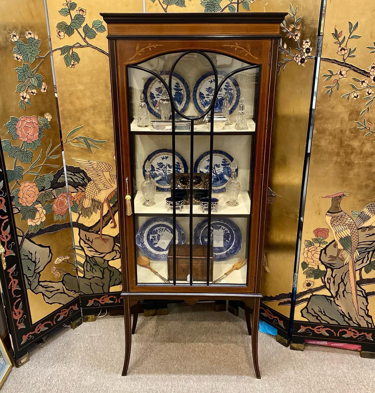 New Arrival~ A petite single door late 19th century mahogany and inlay display cabinet, lined interior, moulded cornice, it&rsquo;s original glass, all standing on slender splayed legs.