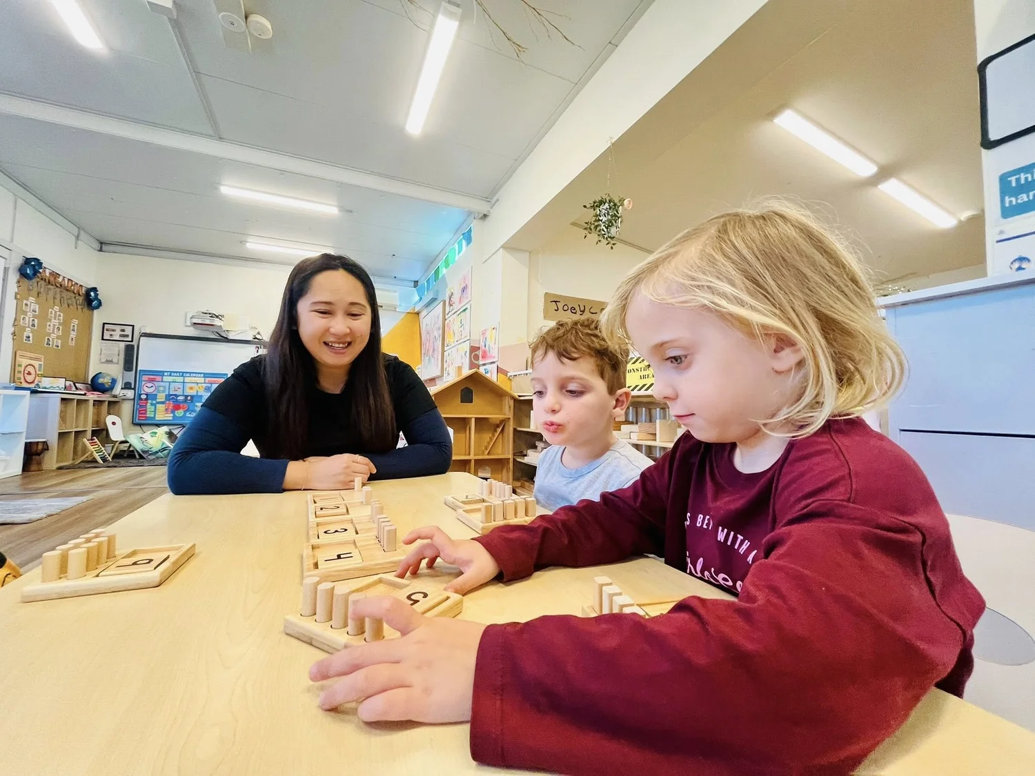 Educator supporting preschool learning at Balgowlah Early Learning