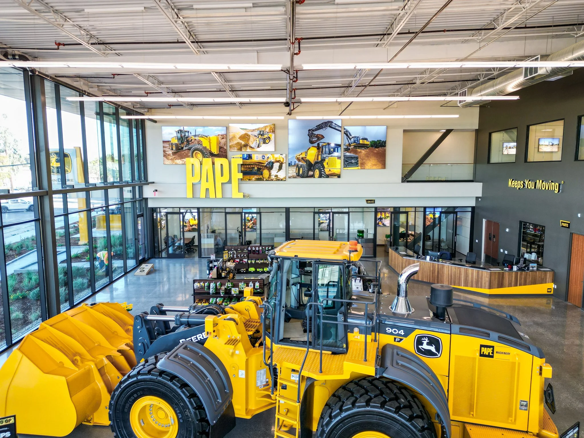 8 foot tall internally lit lettering, internally lit silicone edged graphics, custom made white oak faced desks with ACM graphics.—Fremont CA.