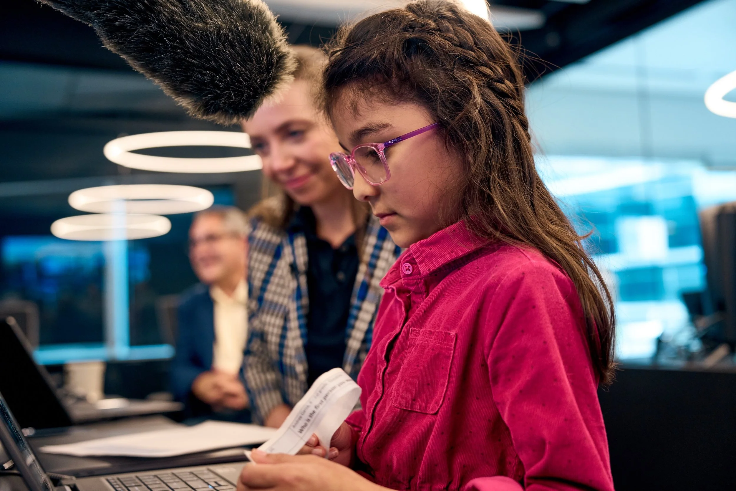 A young girl, the daughter of an Axiom Space employee, looks at a computer screen seeing live images of the Ax-2 astronauts as she and other children ask questions. The Ax-2 astronauts participated in the HERA mission.