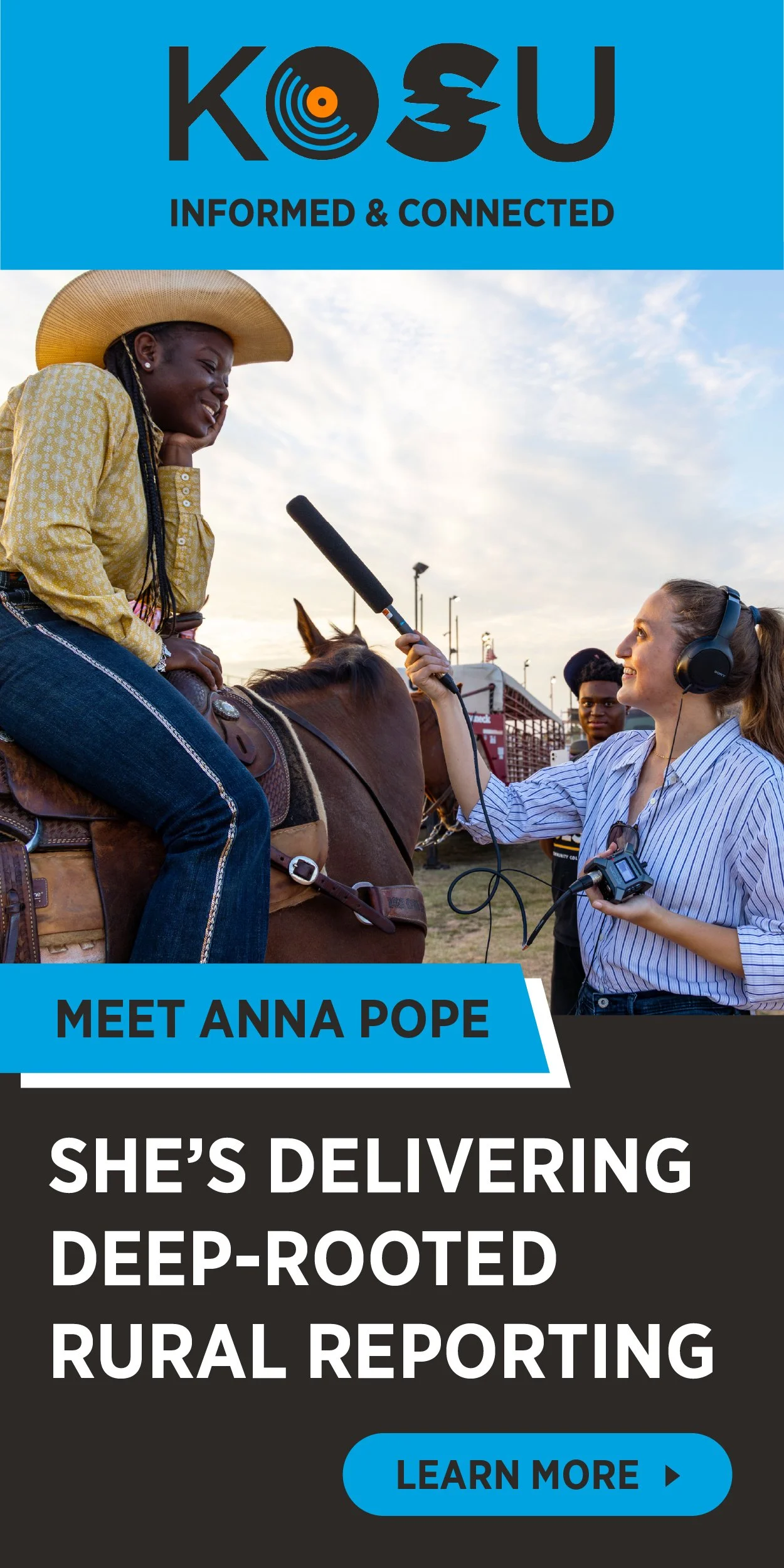 A woman on horseback being interviewed with a microphone by a female reporter wearing headphones at an outdoor event, with a clear sky in the background.