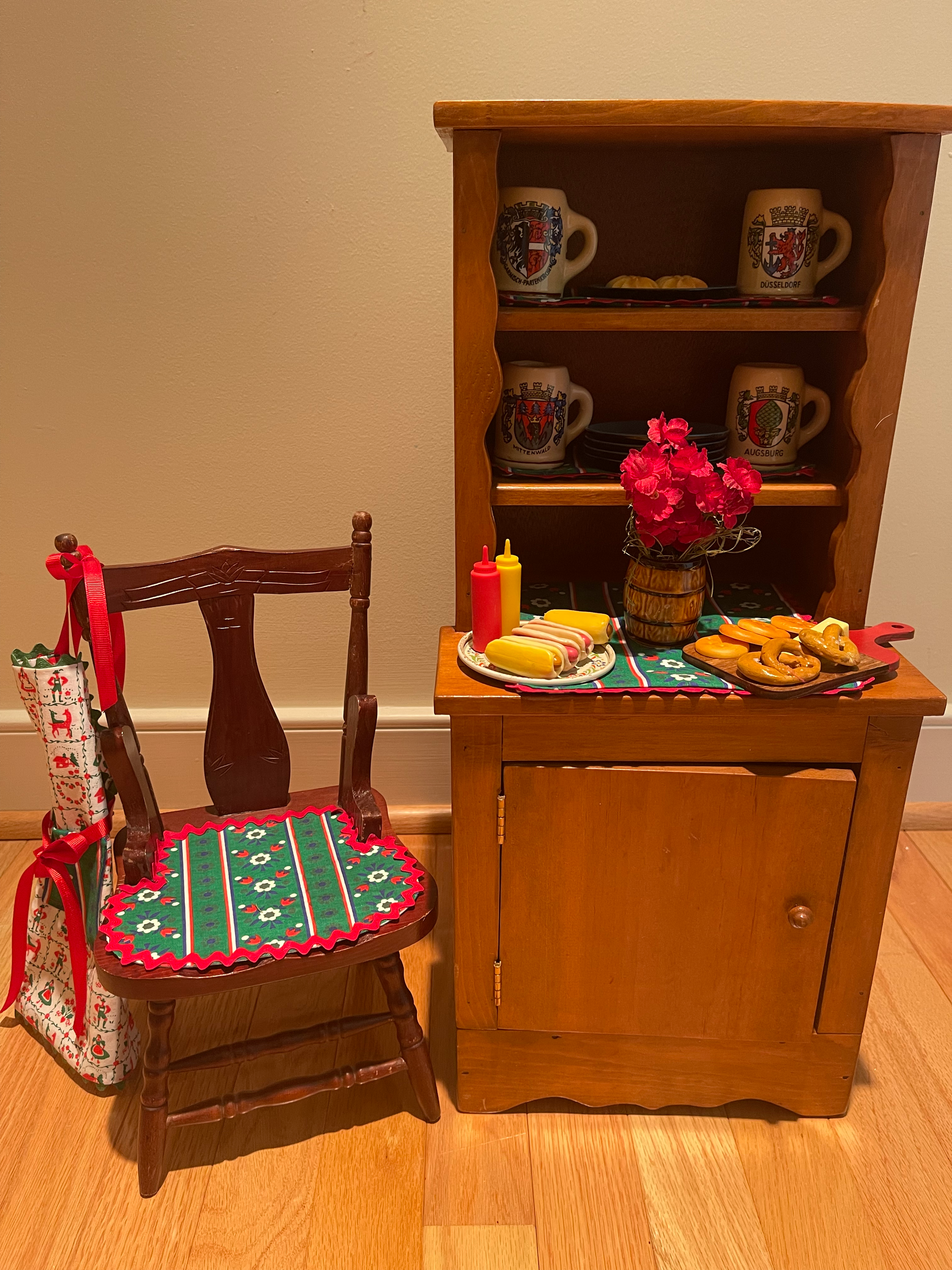 German cupboard with steins, food, snacks. chair and apron. $72