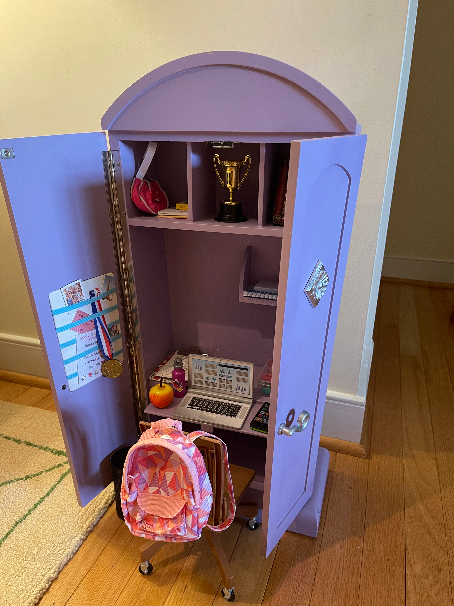 Desk Cabinet  includes desk supplies, rolling desk chair, computer, books, backpack, clipboard, and all you'll need to get homework done. $78