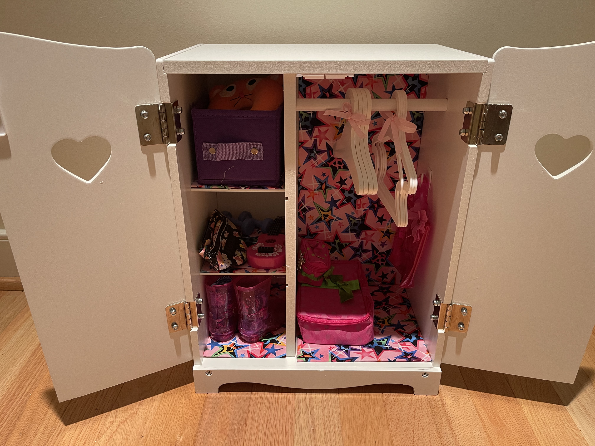 Wood wardrobe featuring lots of travel and fun accessories. Hangers included. $68