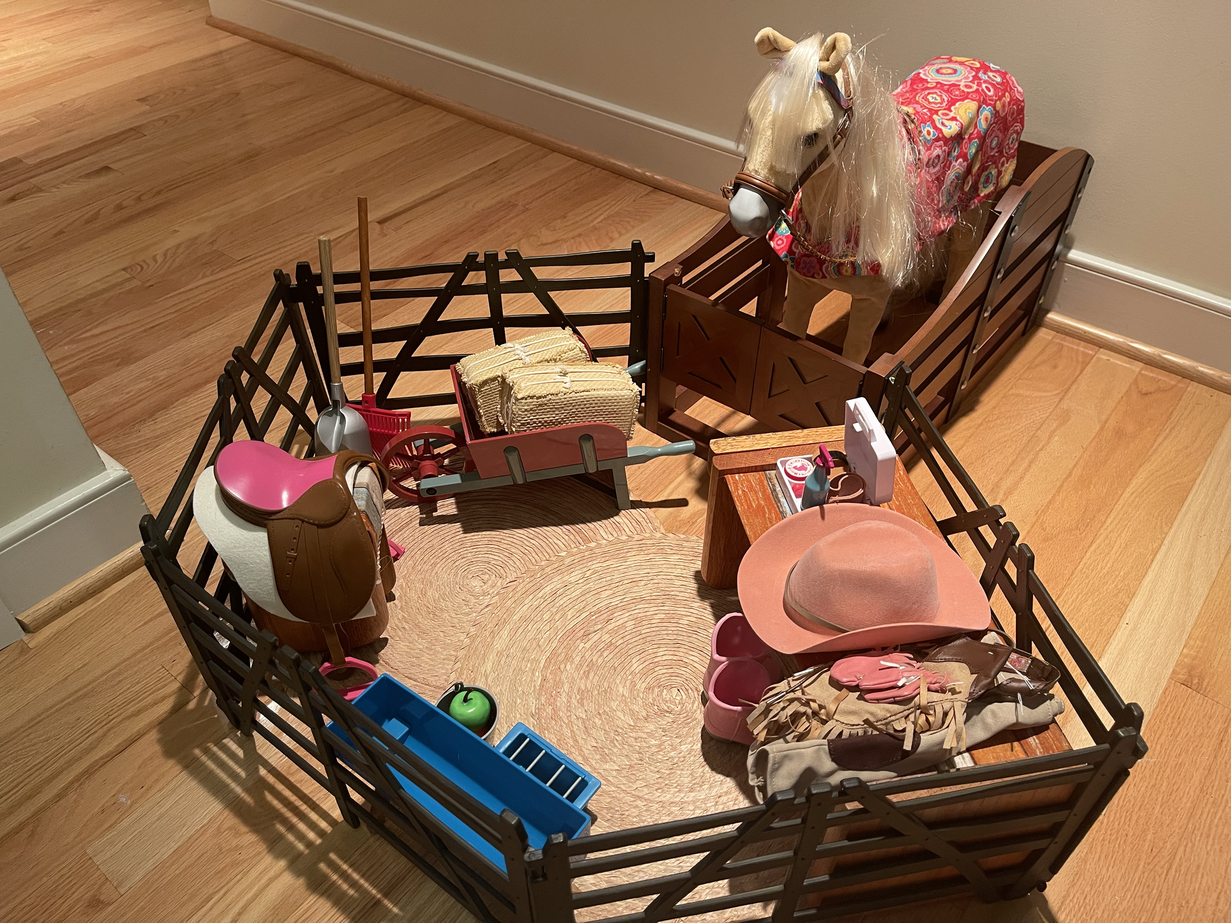 This complete horse set includes a stall, fence, wheelbarrow, saddle stand, water trough, western gear for rider, accessory set. $195