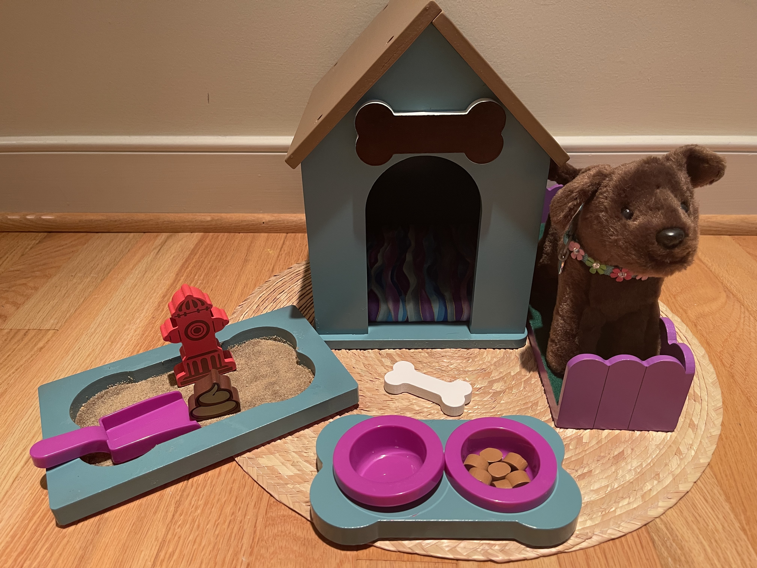 This up-cycled dog set features a discontinued American Girl dog, along with a wooden dog house, food tray, sandbox, play yard with toys. $68