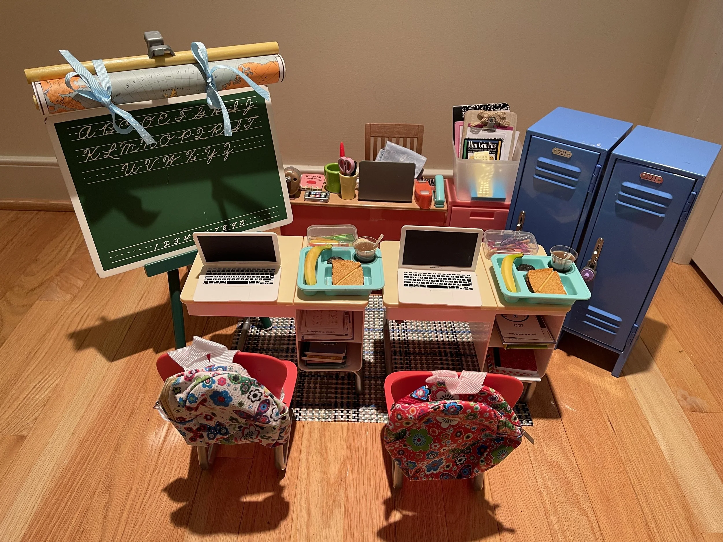 Classroom 1. This set has a lot of up cycled American Girl accessories: student desks, lockers, blackboard. There are numerous worksheets, books, school supplies for fun with friends. $165