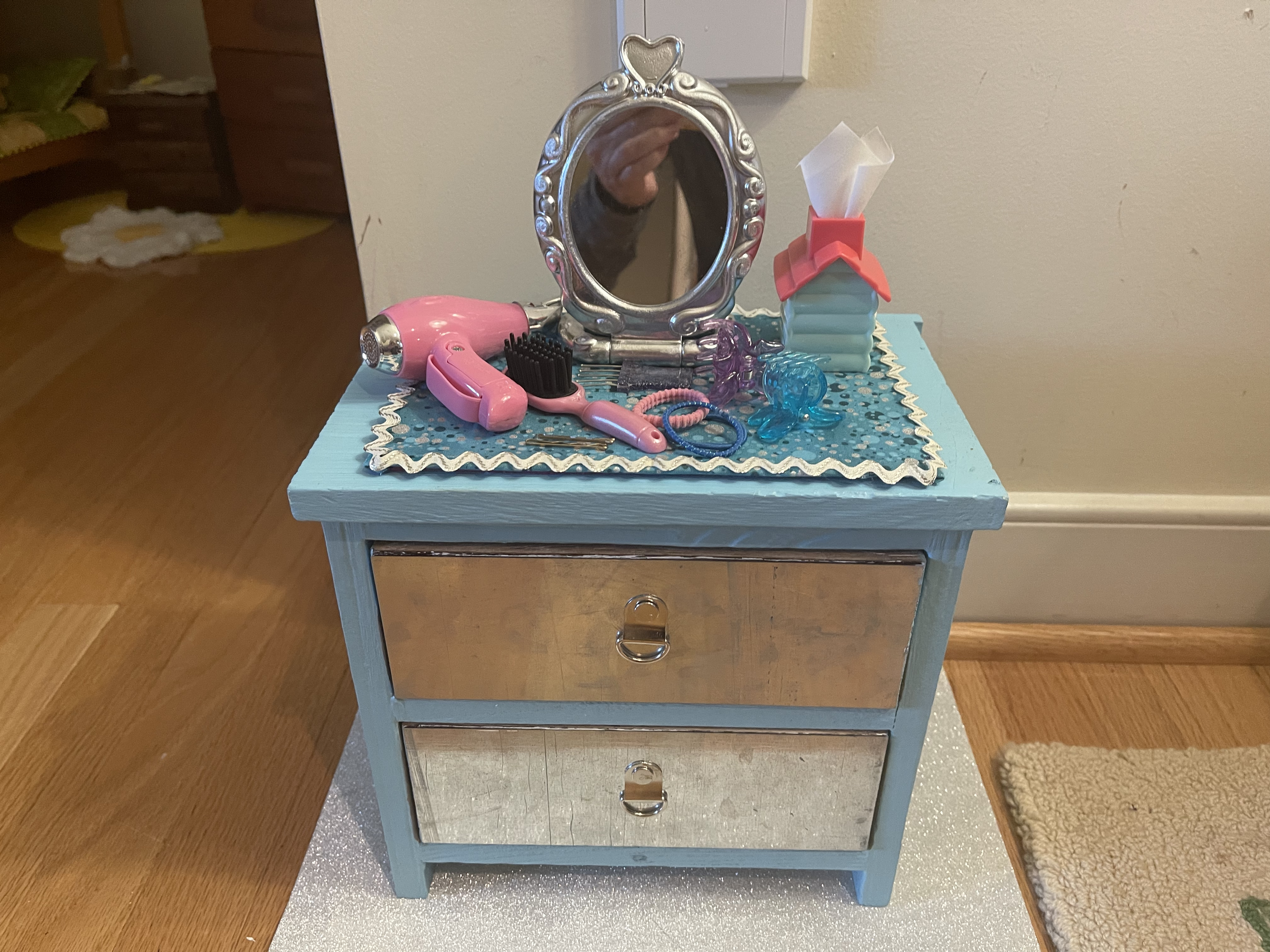 This fun 2-drawer dresser features hair accessories, a mirror, and a tissue bos. $46