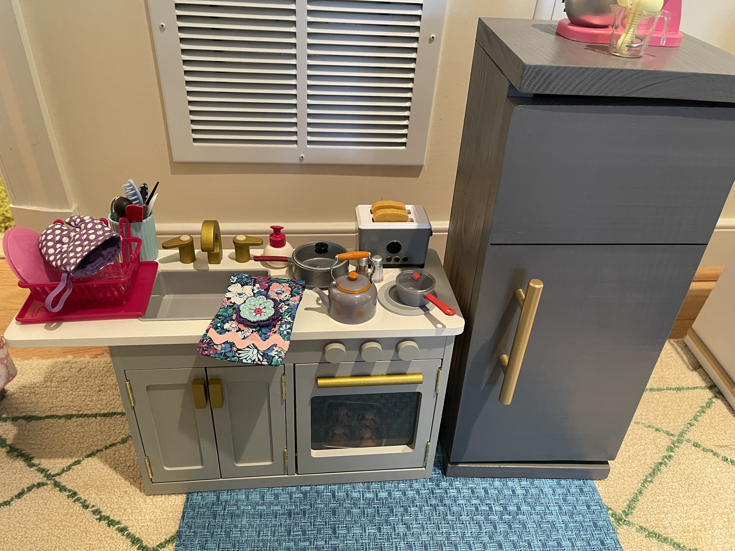 Kitchen 2 has a fully stocked refrigerator and cabinets to make meal prep fun. There is also an apron hanging on the side of the refrigerator. $88