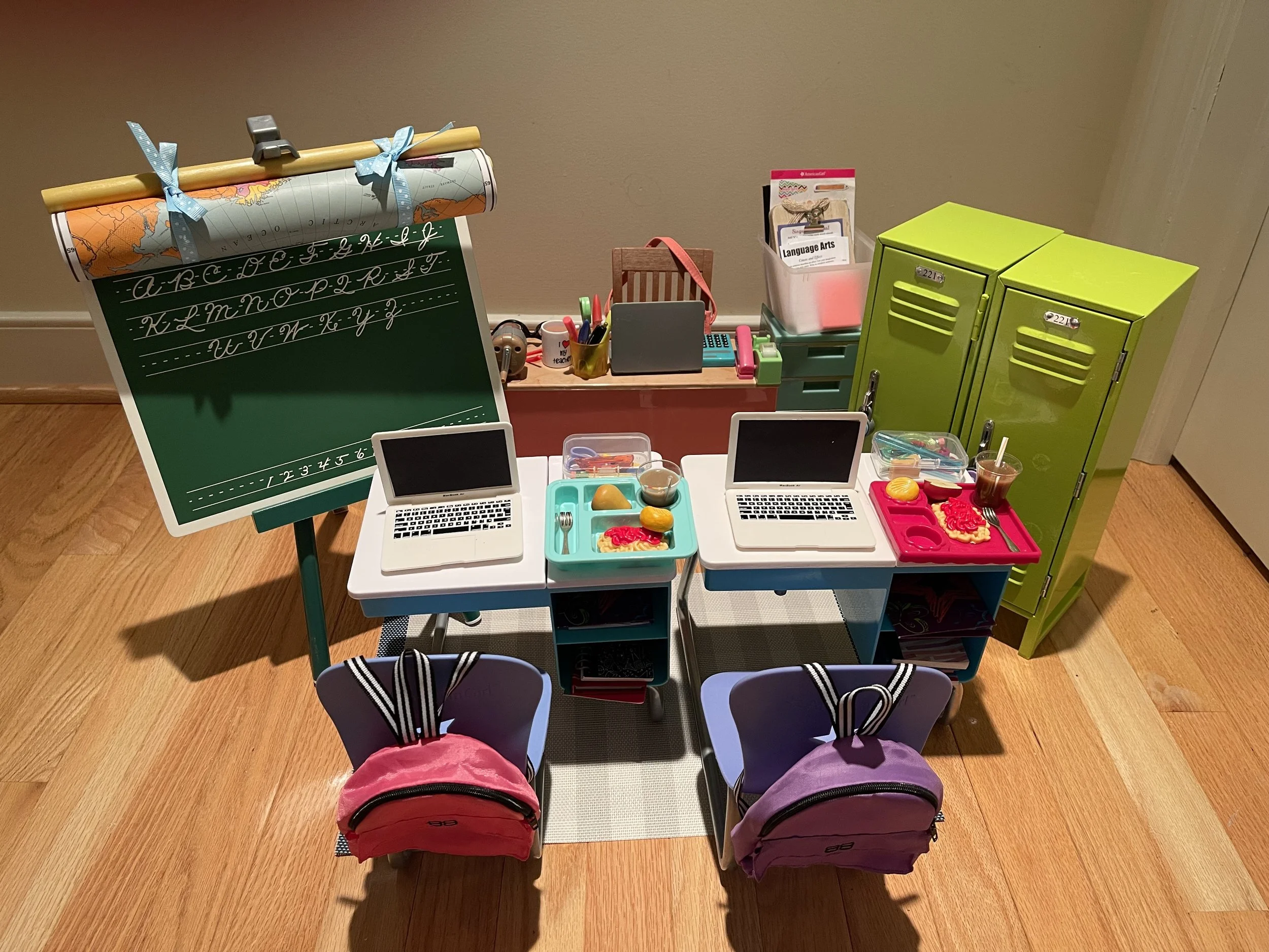 Classroom 2. This set has a lot of up cycled American Girl accessories: student desks, lockers, blackboard. There are numerous worksheets, books, school supplies for fun with friends. $165