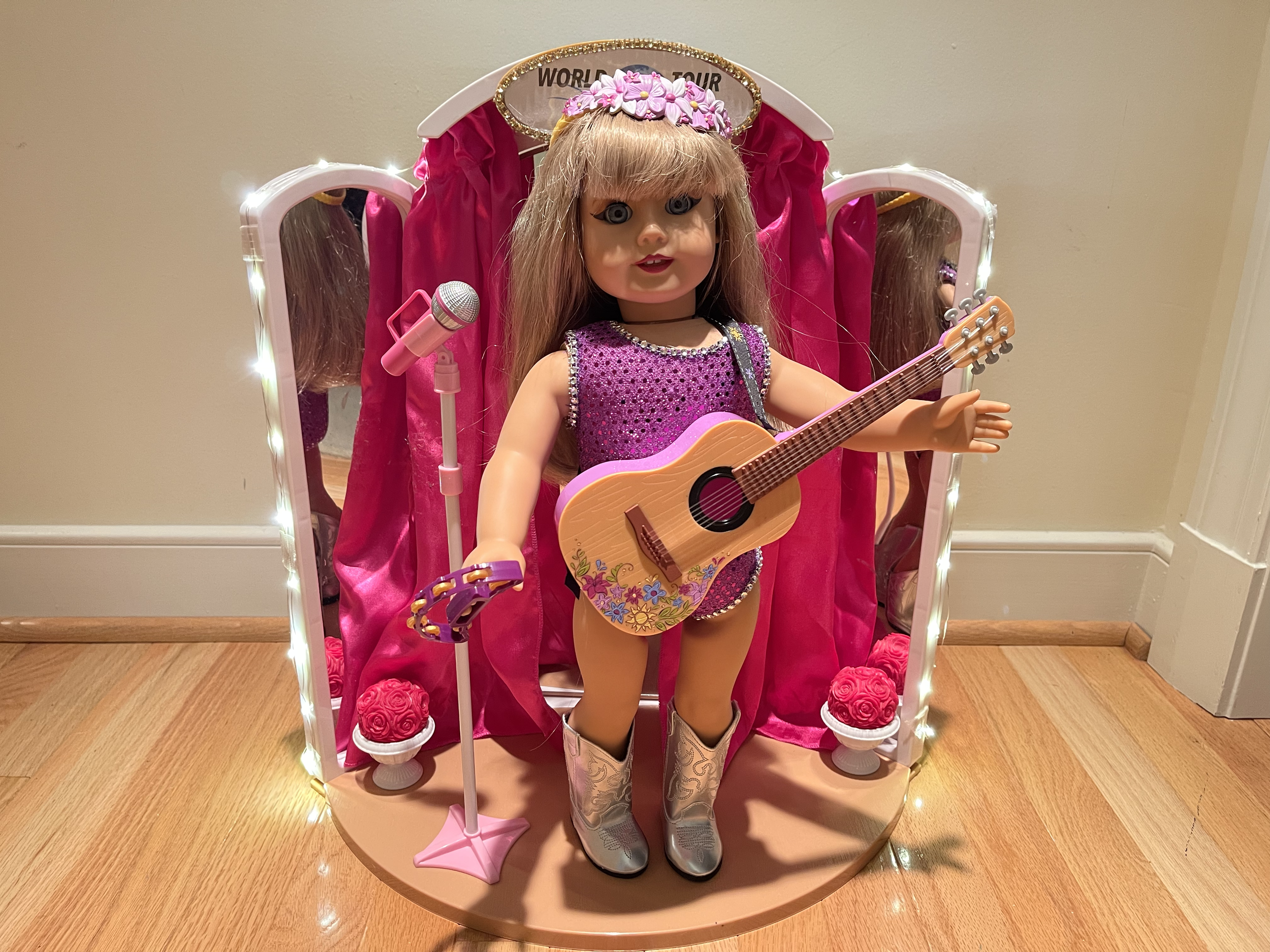 Pop Star 1. This item features a genuine up cycled American Girl doll. Her face has been beautifully painted and sealed with a beautiful make-up. Stage is lighted. Sparkly outfit and shiny boots are included. $210