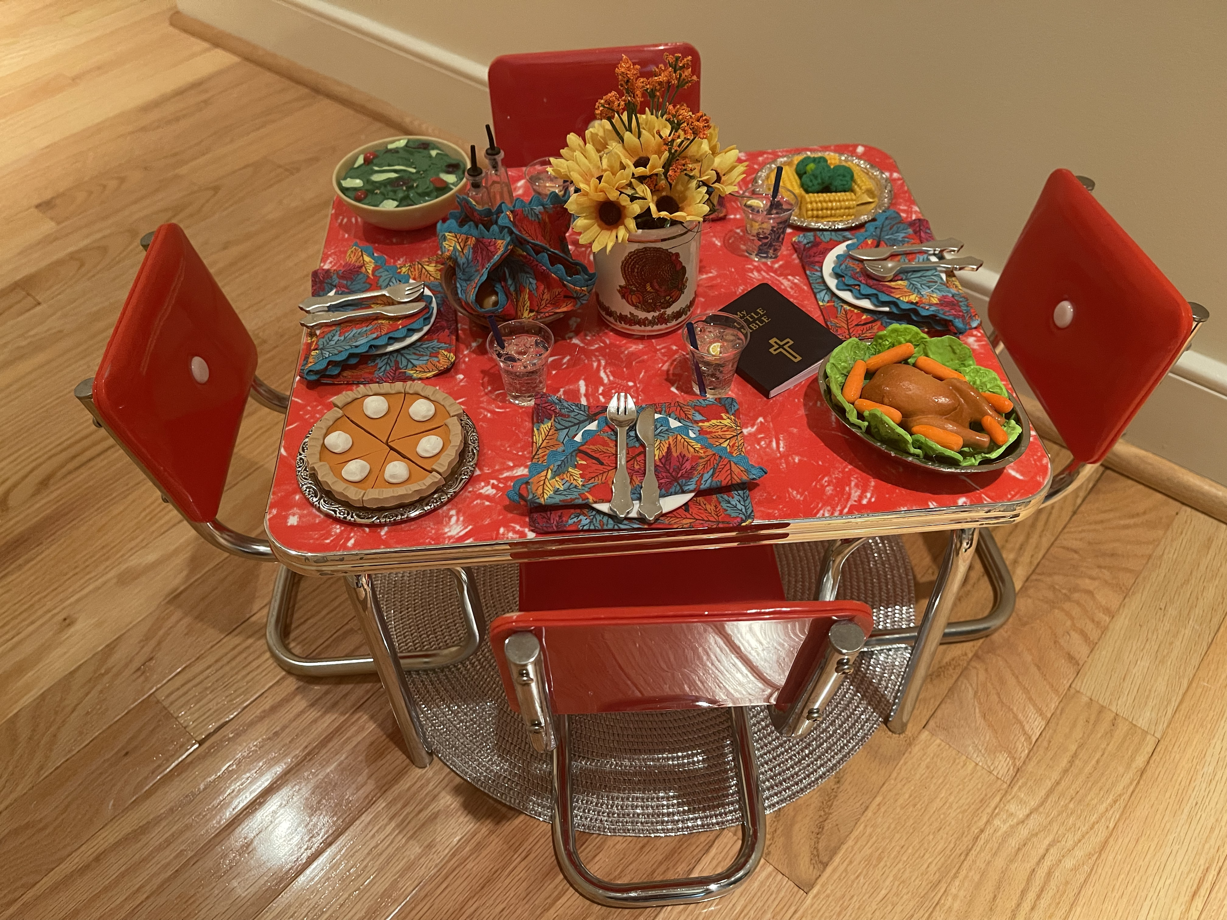 Thanksgiving feast for 4 features everything needed for a savory celebration, including a Bible. Pieces are discontinued AG furniture. $112