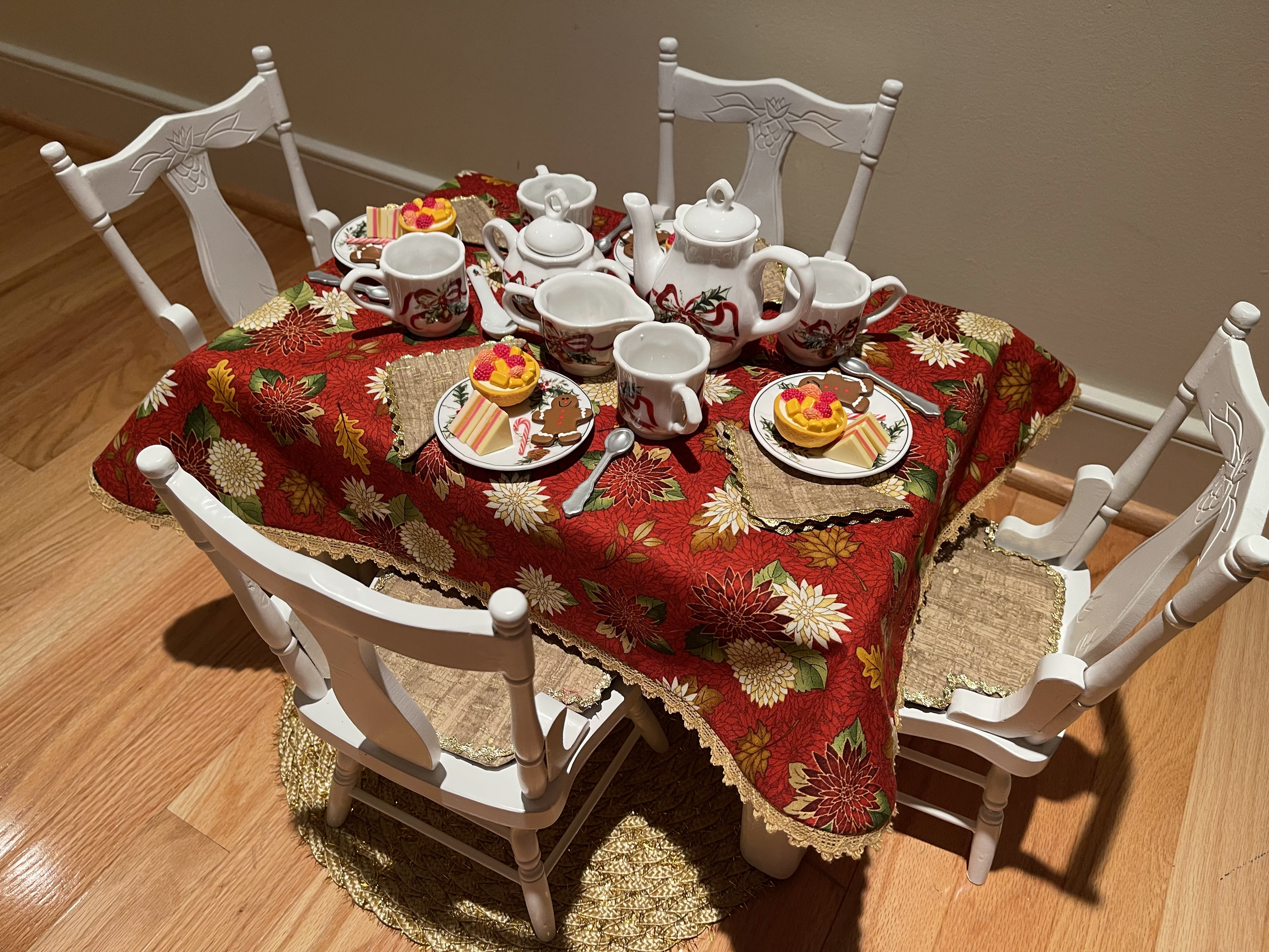 Holiday lunch and tea for 4. This set features a lovely china tea set. Tablecloth is reversible to a non-holiday fabric. $96