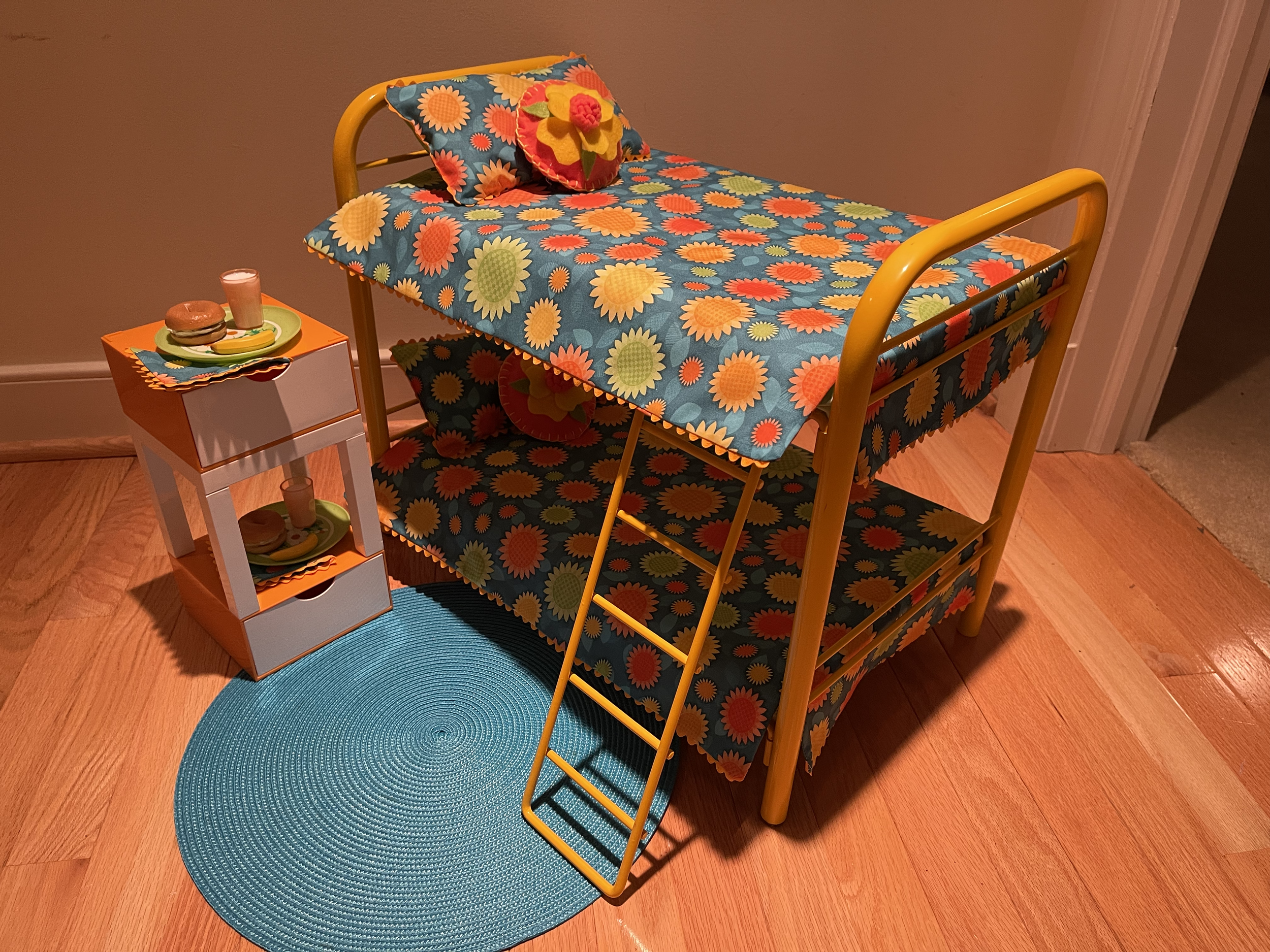 This metal bunk bed set features a fun fabric and a double-deck nightstand with snacks. $92