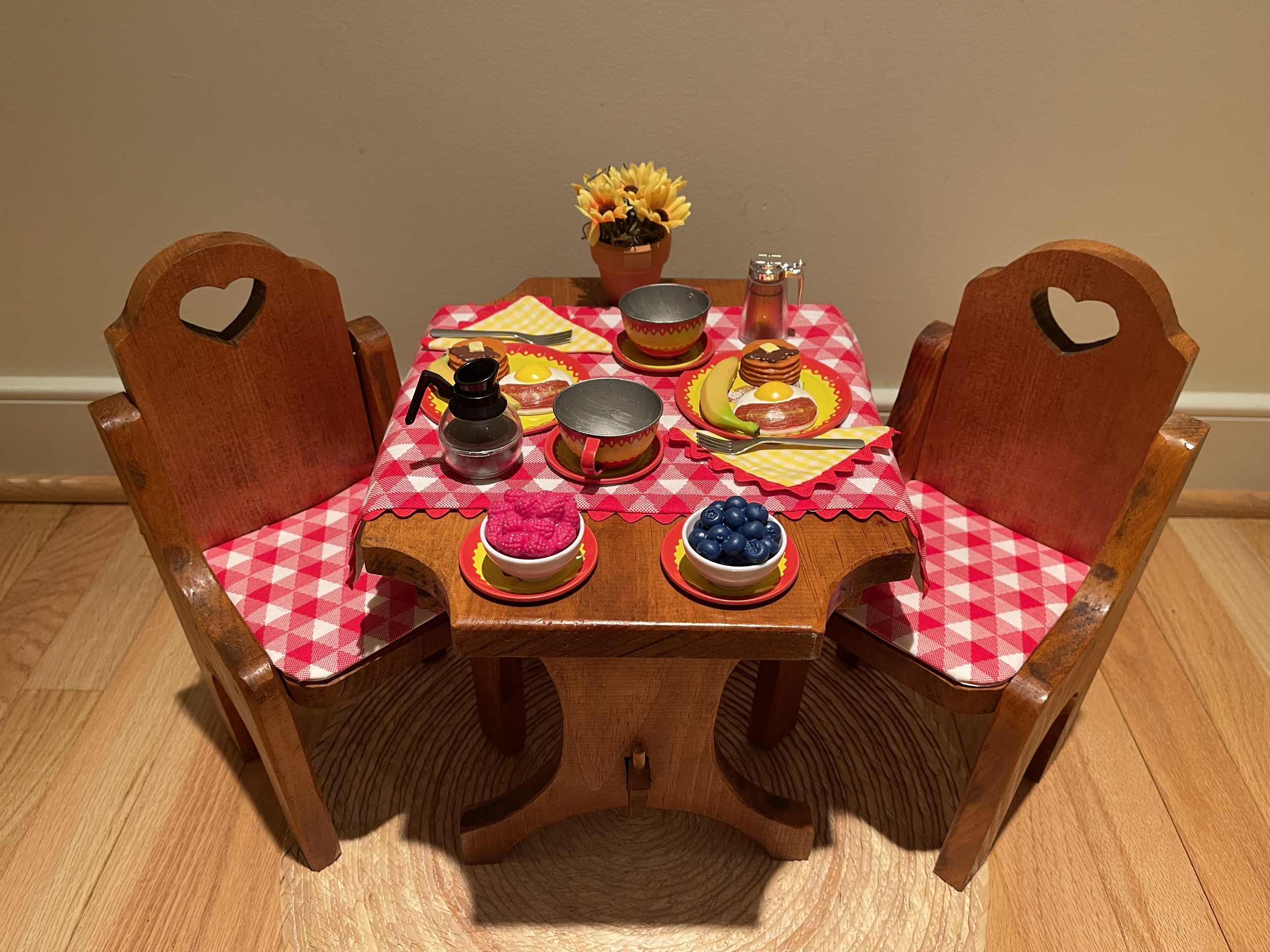 This breakfast table features vintage tin Curious George dishes in great shape! Two 18" dolls would be very comfortable at this table! $72