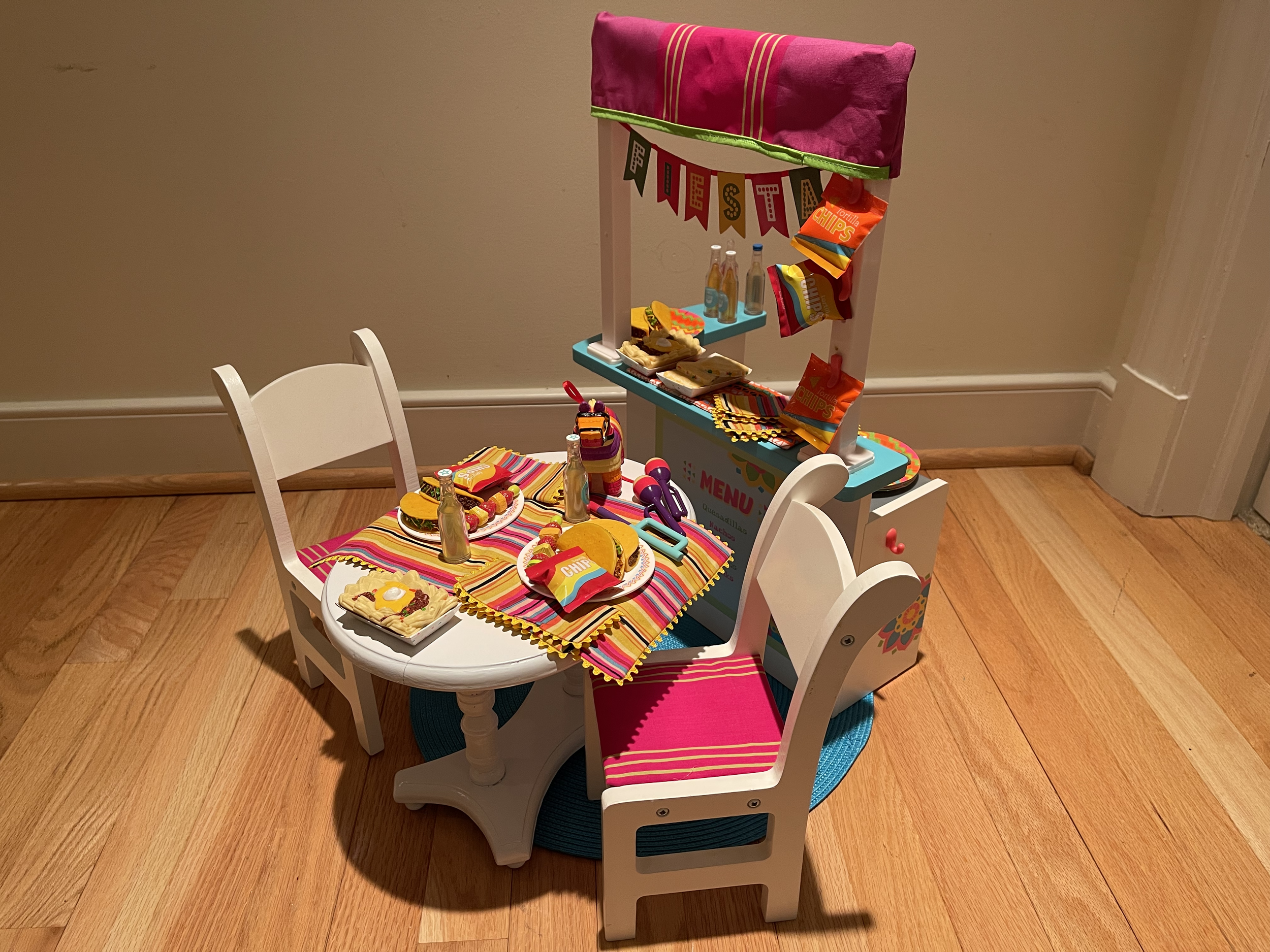 Fiesta stand set features lots of Mexican food, cooking supplies, table and dinner for 2. $96