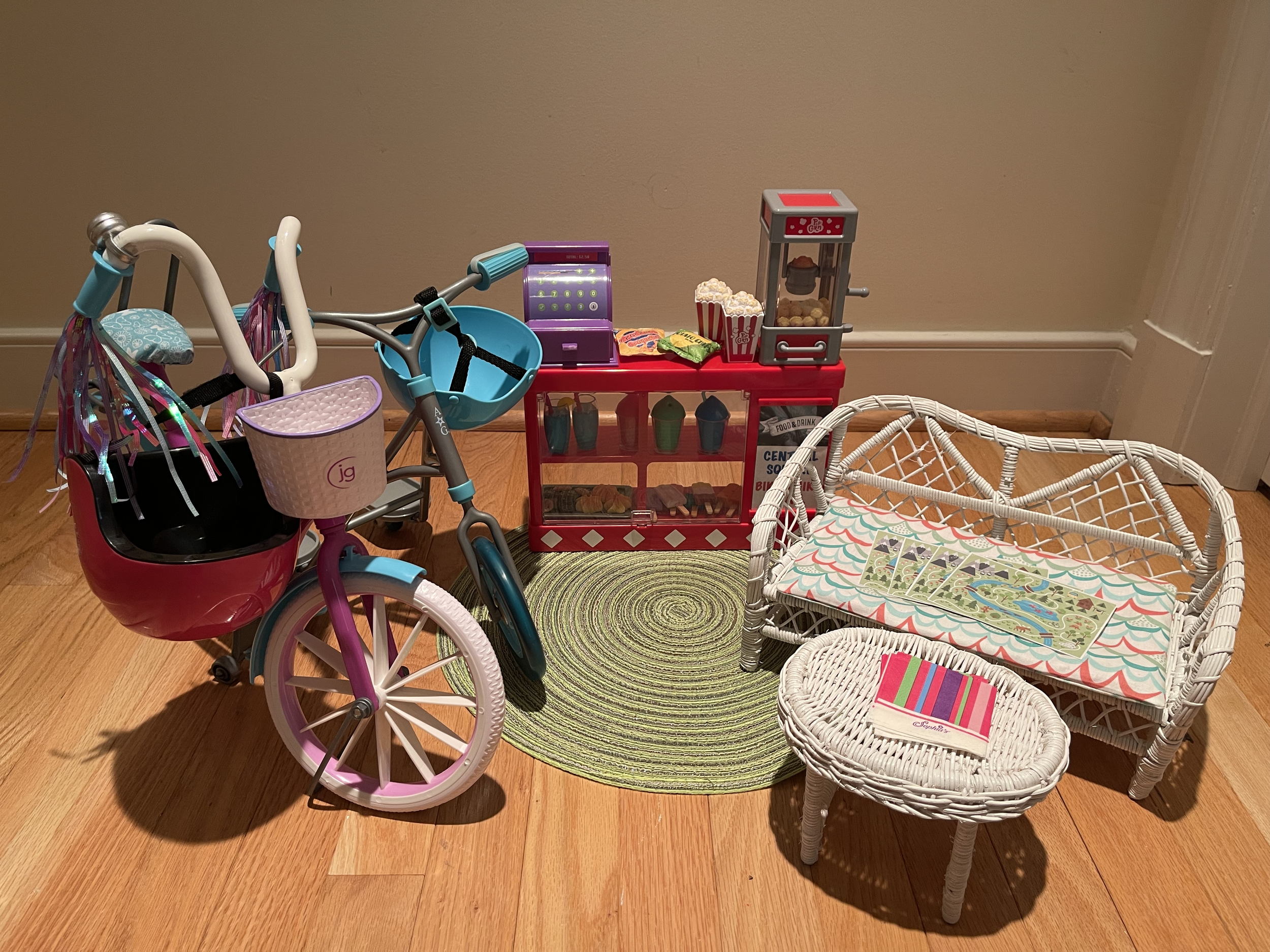 This set includes a bike and scooter suitable for 18" dolls, along with helmets. There is a snack and drink bar, resting sofa, trail maps. $88
