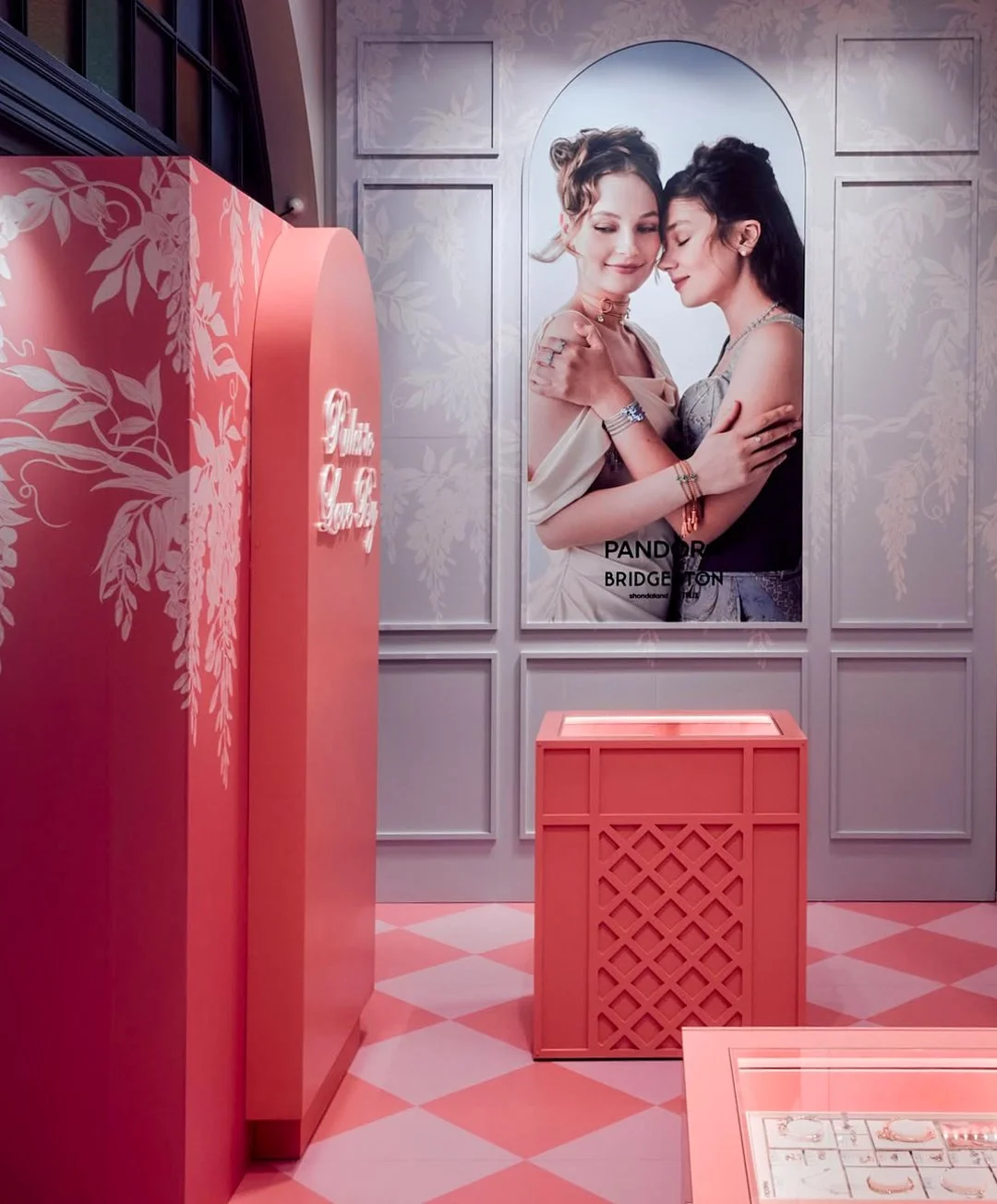 Image of Pandora x Bridgerton retail pop-up storefront window with illustrated wisteria by artist Maggie Enterrios for netflix