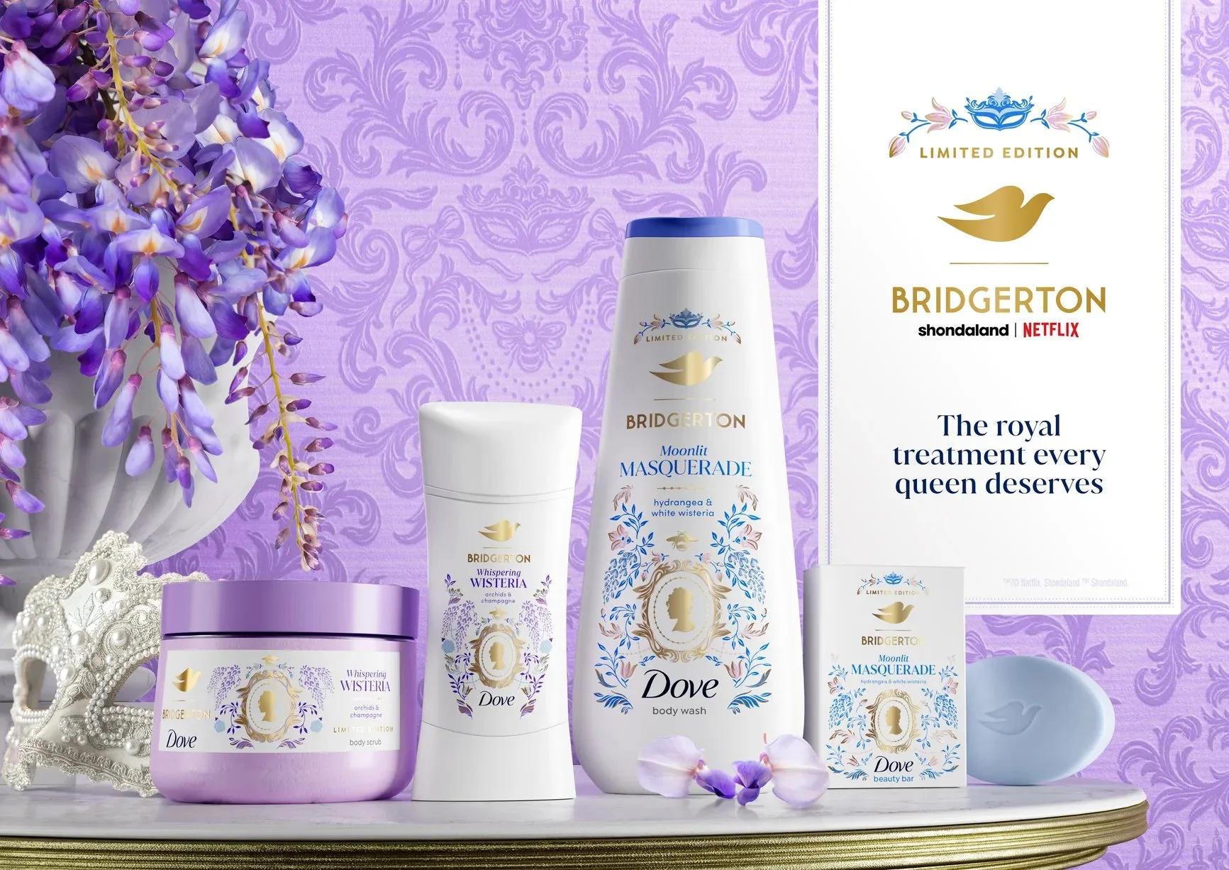A display of lavender-themed beauty products, including a body scrub, body wash, body bar, and a small soap with a lavender crown decoration, set against a lavender patterned background illustrated by Maggie Enterrios for Netflix Bridgerton x Dove.