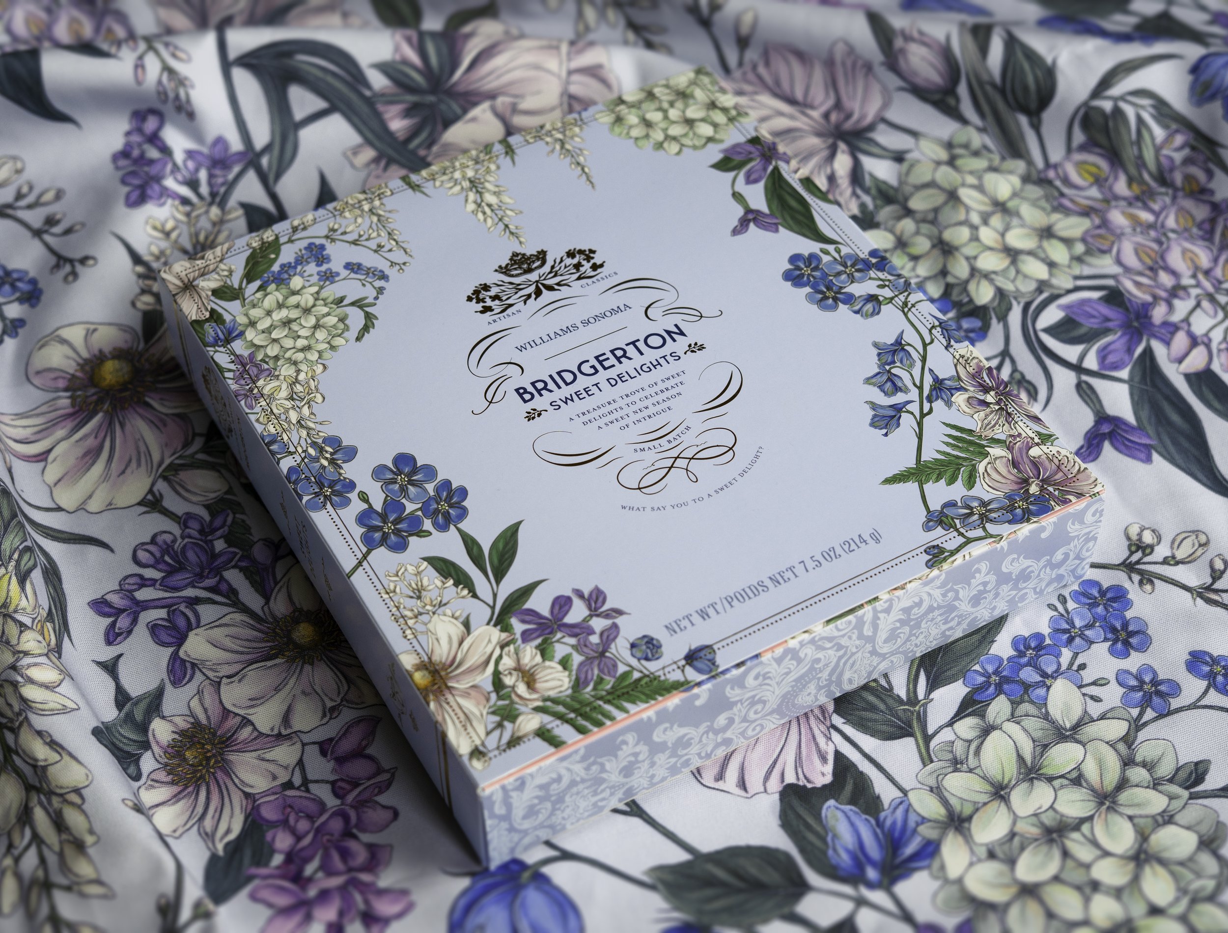 Bridgerton Sweet Delights advent calendar packaging illustrated by Maggie Enterrios photographed on floral background
