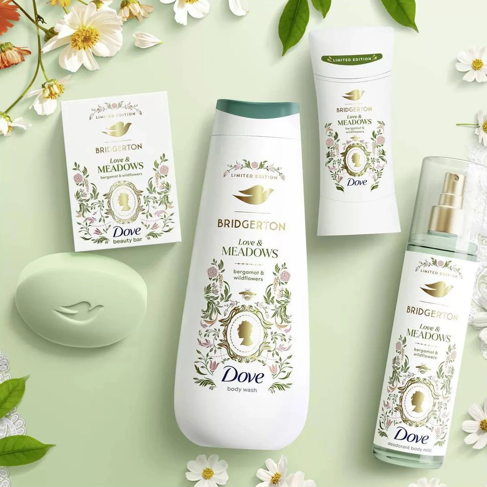 Collection of Dove & Bridgerton products on a light green background, including body wash, deodorant body spray, and bar soap, illustrated by Maggie Enterrios with floral and leaf designs, surrounded by white flowers and green leaves.