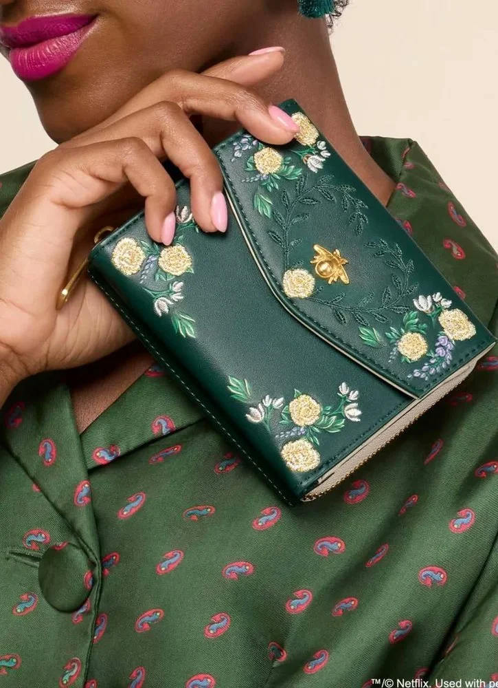 Pattern illustration by Maggie Enterrios for Bridgerton Loungefly limited edition collection. Image of green embroidered purse
