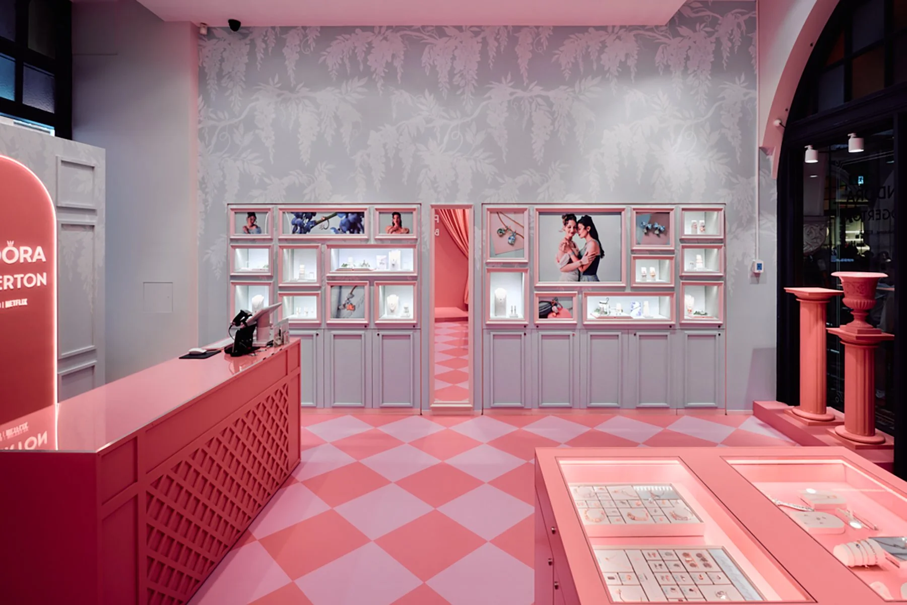 Image of Pandora x Bridgerton retail pop-up storefront window with illustrated wisteria by artist Maggie Enterrios