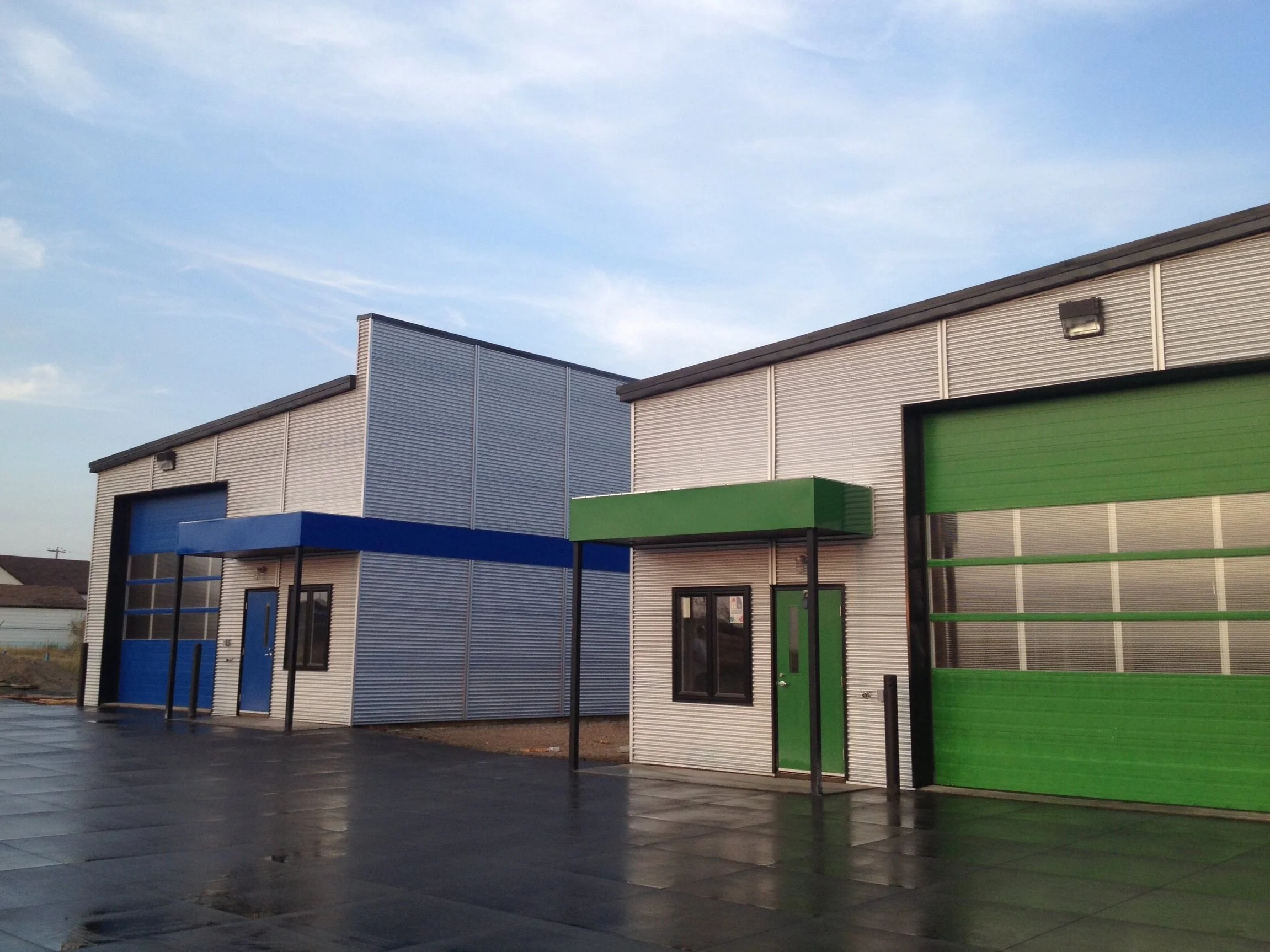Modern commercial building exteriors with decorative concrete parking at a Commercial Project by Blackrock Homes & Commercial in Grande Prairie, Alberta