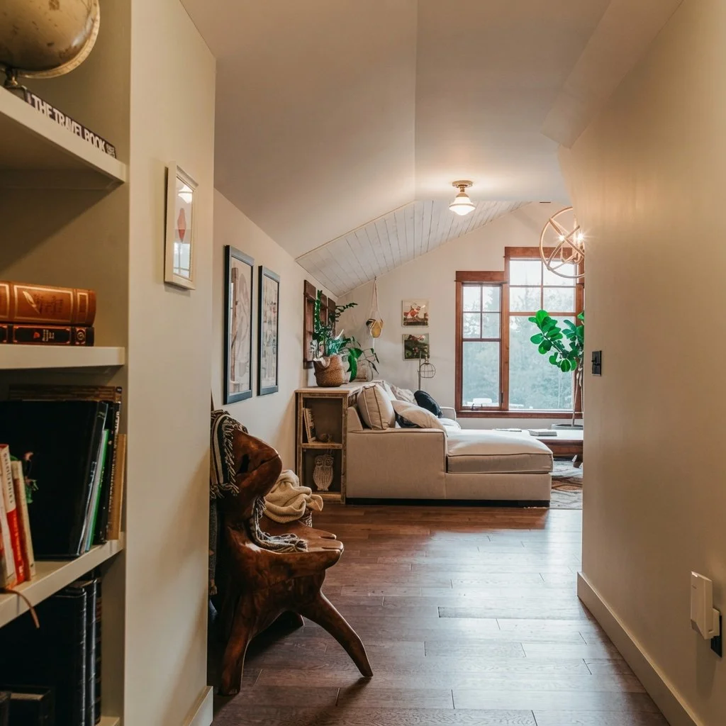 Custom home built-in bookshelves with reading nook and hardwood flooring