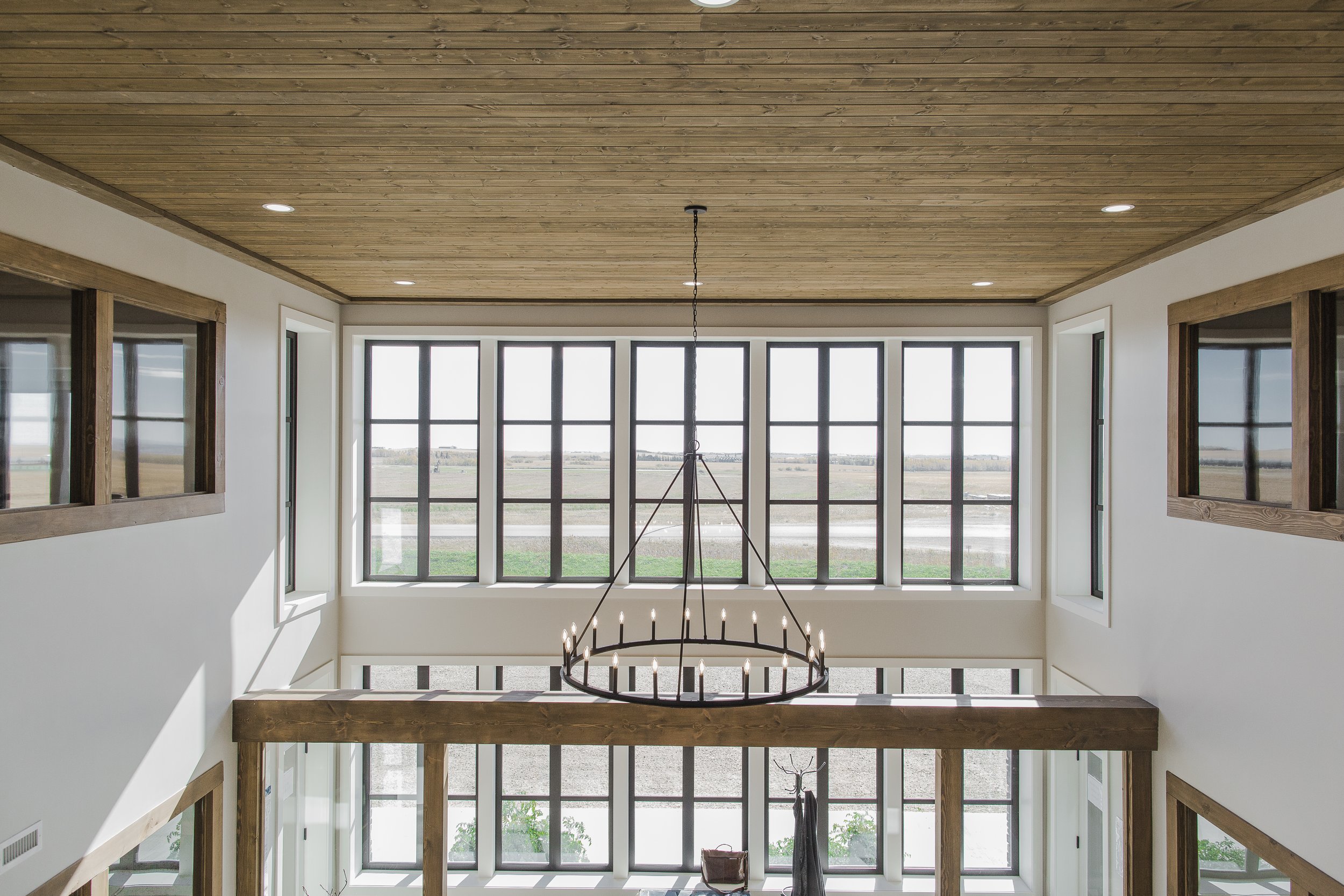 Luxury office interior with wood ceilings, glass and timbers at a design build Commercial Project by Blackrock Homes & Commercial in Grande Prairie, Alberta