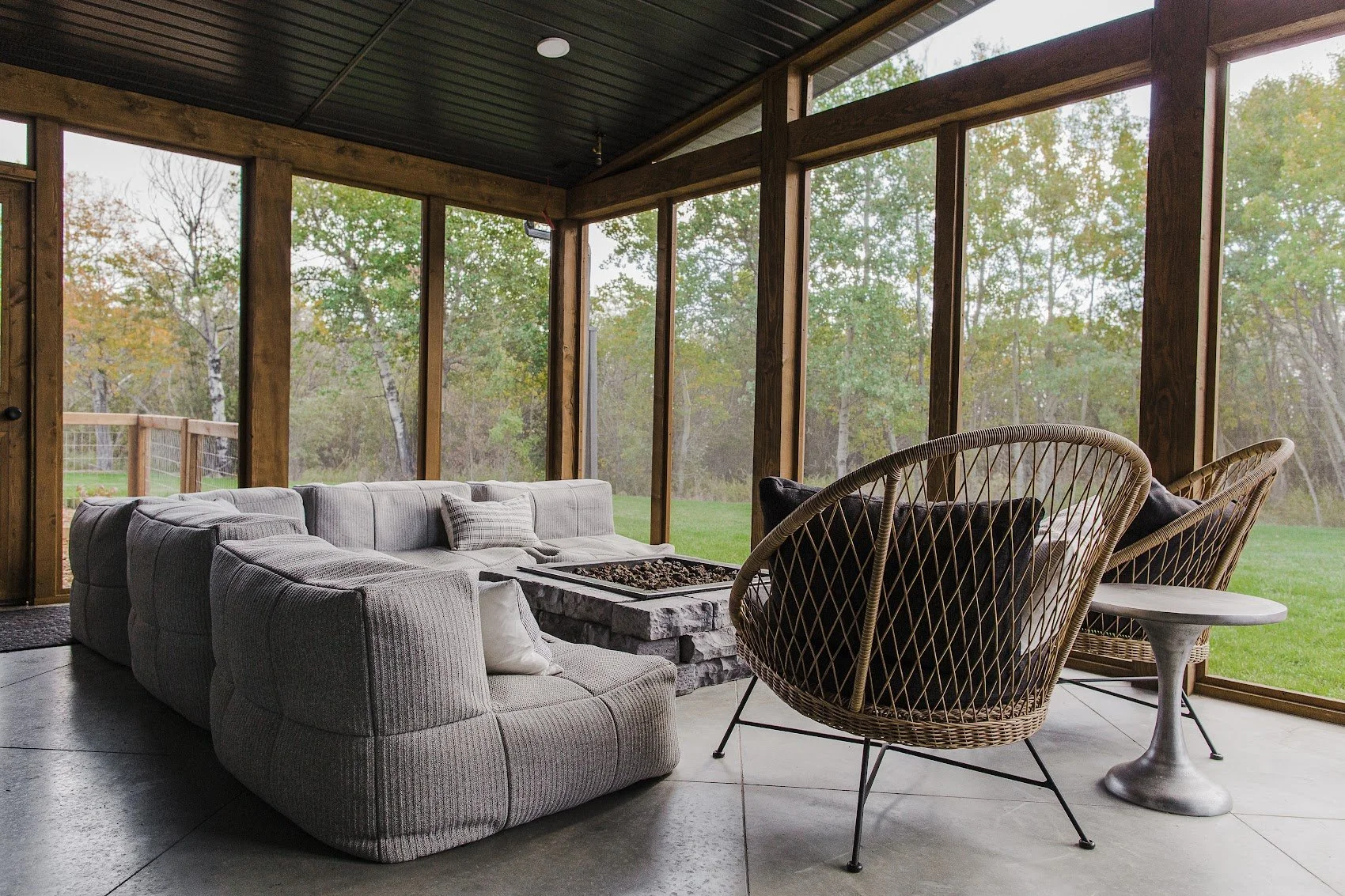 Screened patio with firepit at a Grande Prairie custom home builder acreage home