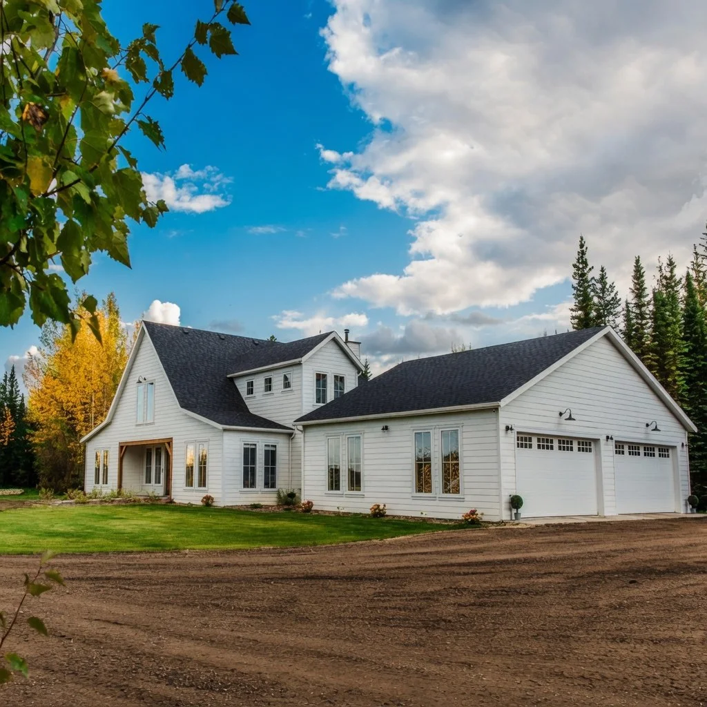 Custom home white farmhouse exterior with attached garage on an autumn day