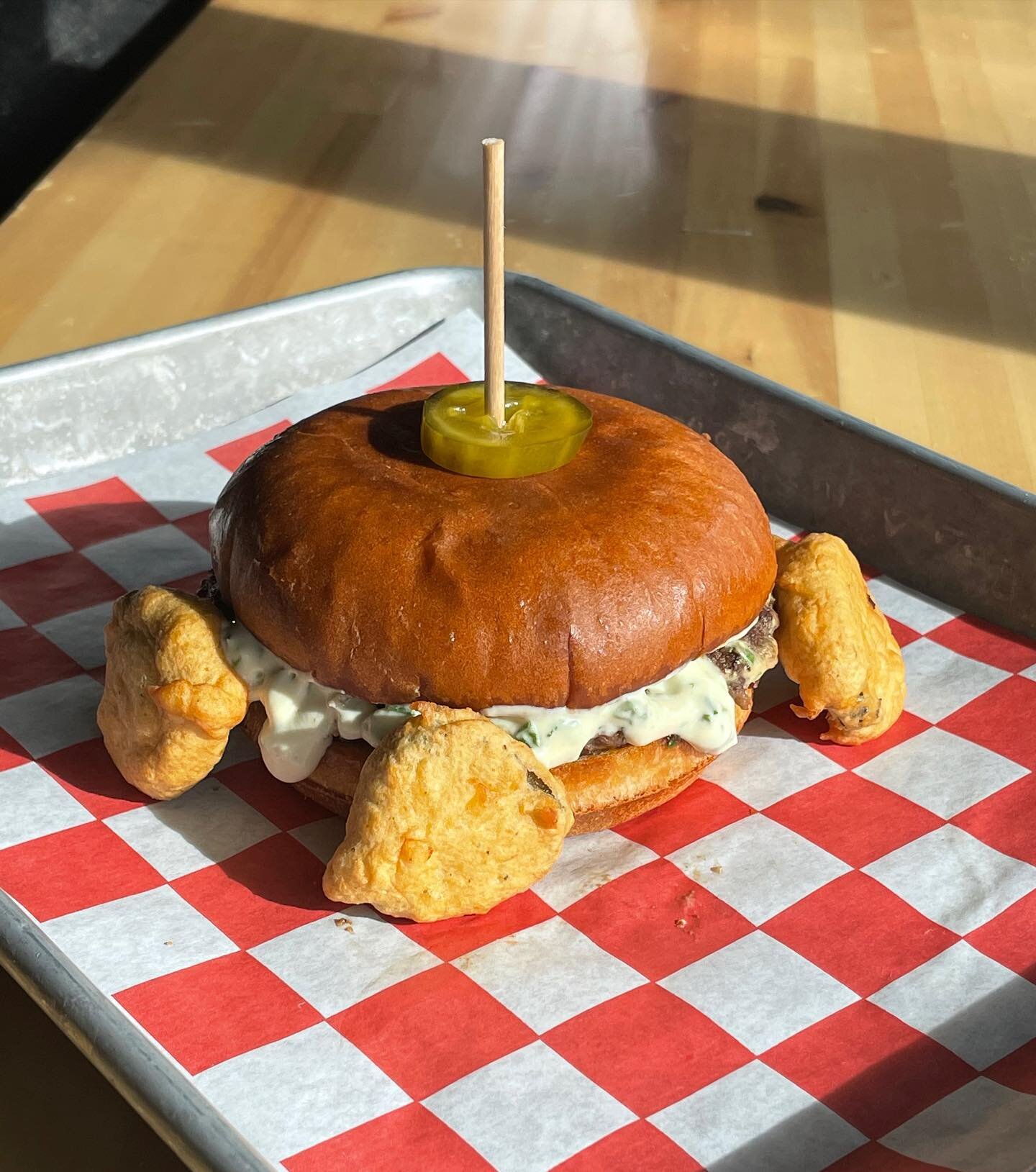 Chef Manny chose &ldquo;Baby You Can Chive My Car Burger&rdquo; for the Bob&rsquo;s Burgers Burger of the Week.
Season 5, Episode 6: Father of the Bob

A feta stuffed burger on a chive-tastic bun. Topped with a million diced chives and a creamy sour 