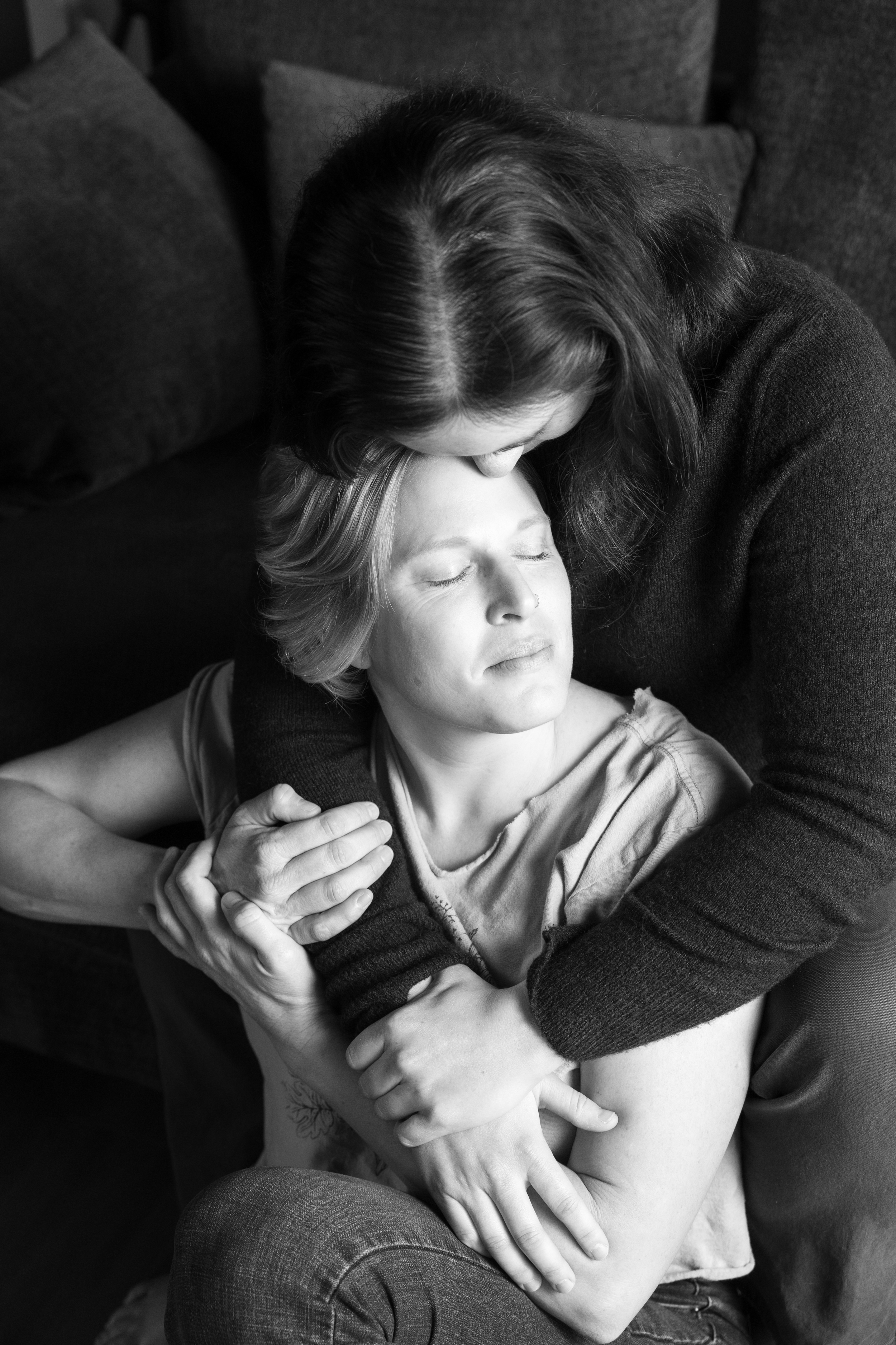 Black and white portrait of a same-sex couple sharing a tender embrace during a Just BE Experience in San Luis Obispo—an intimate, soulful celebration of love and connection. Our studio proudly welcomes and celebrates the LGBTQ+ community.